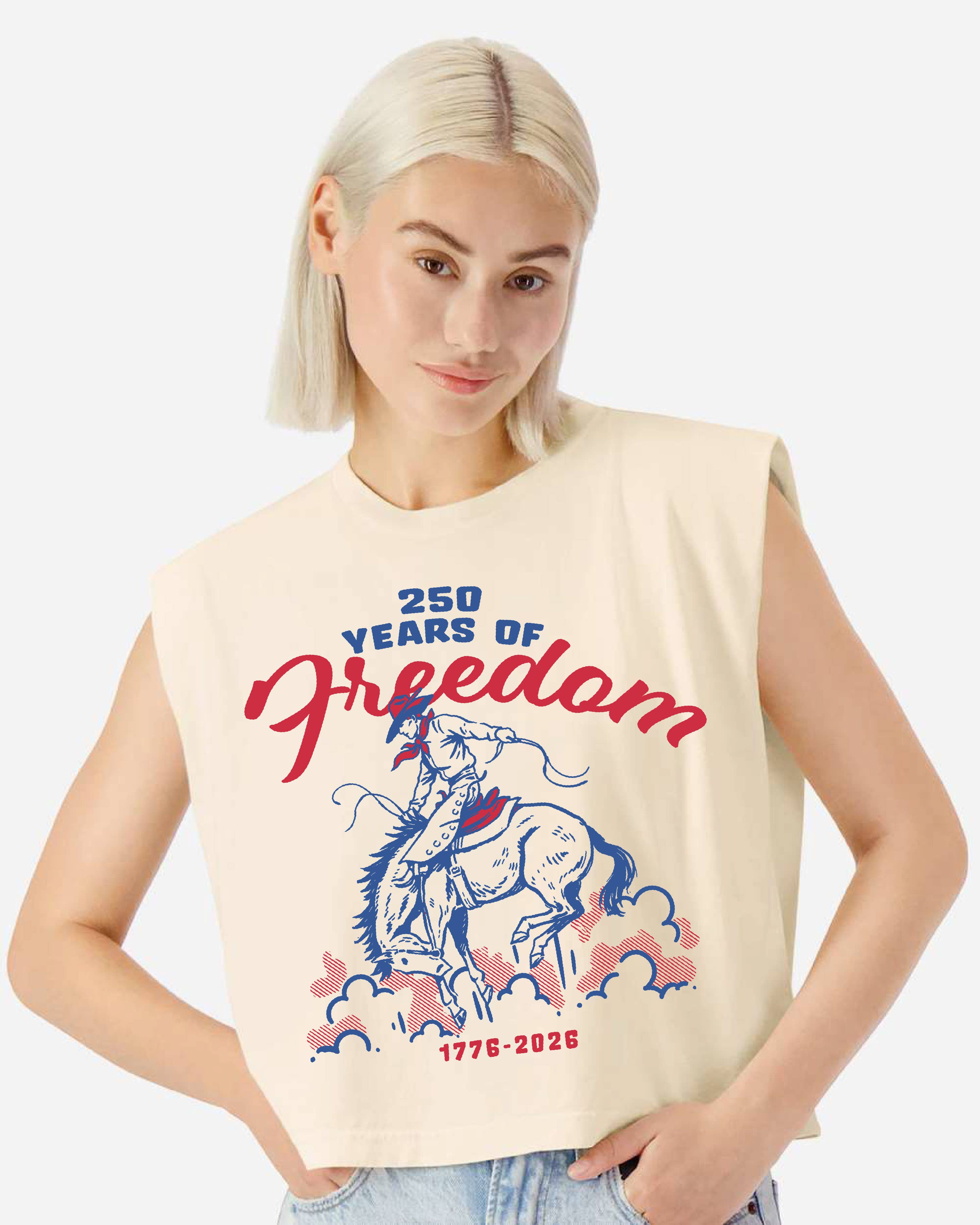 Person wearing a cream sleeveless tee shirt with '250 Years of Freedom' bucking horse design on a white background