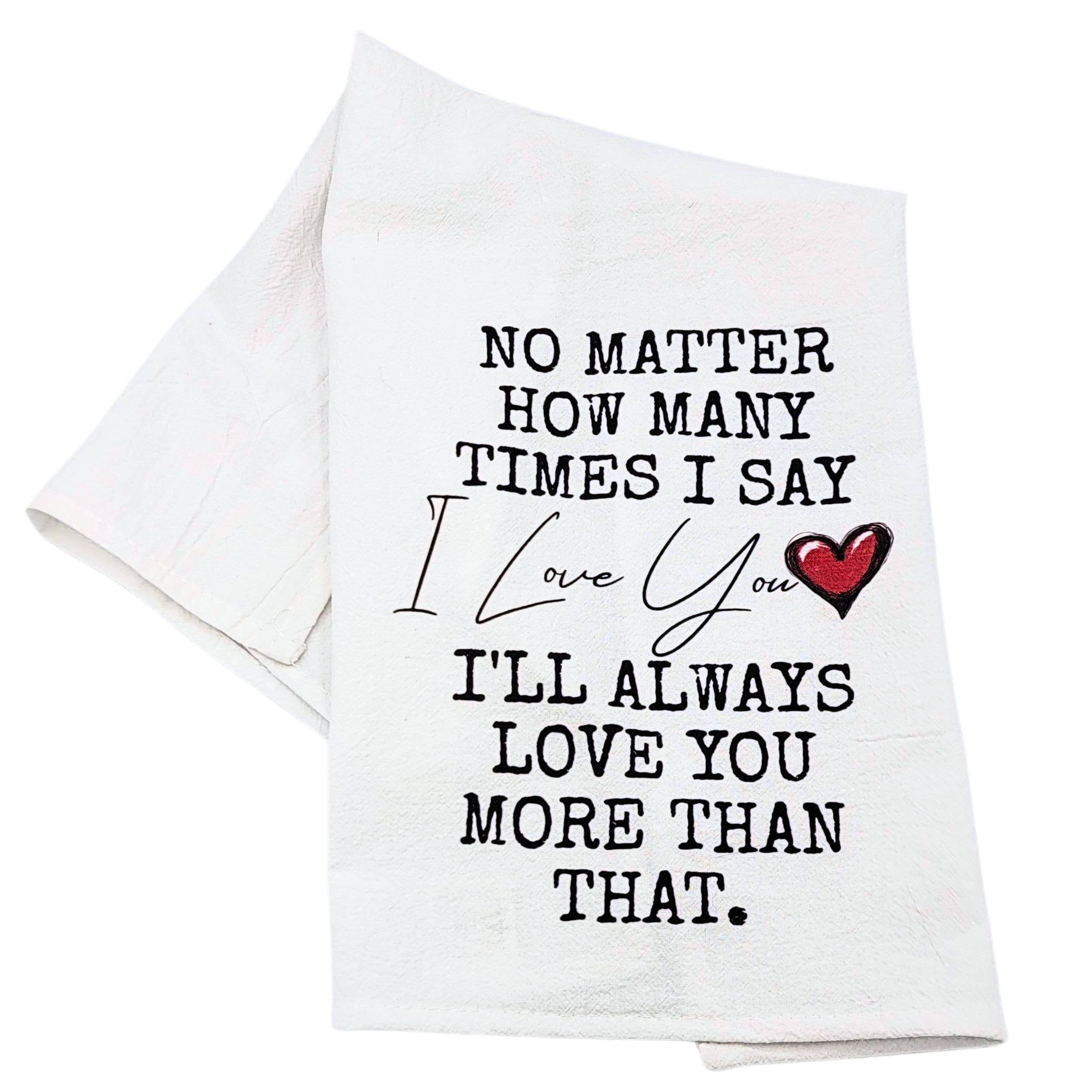 White towel with black text and red heart on a white background