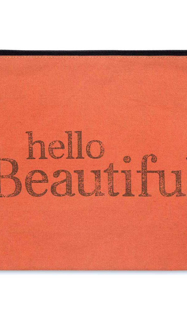Rust pouch with 'hello Beautiful' text in black on a white background