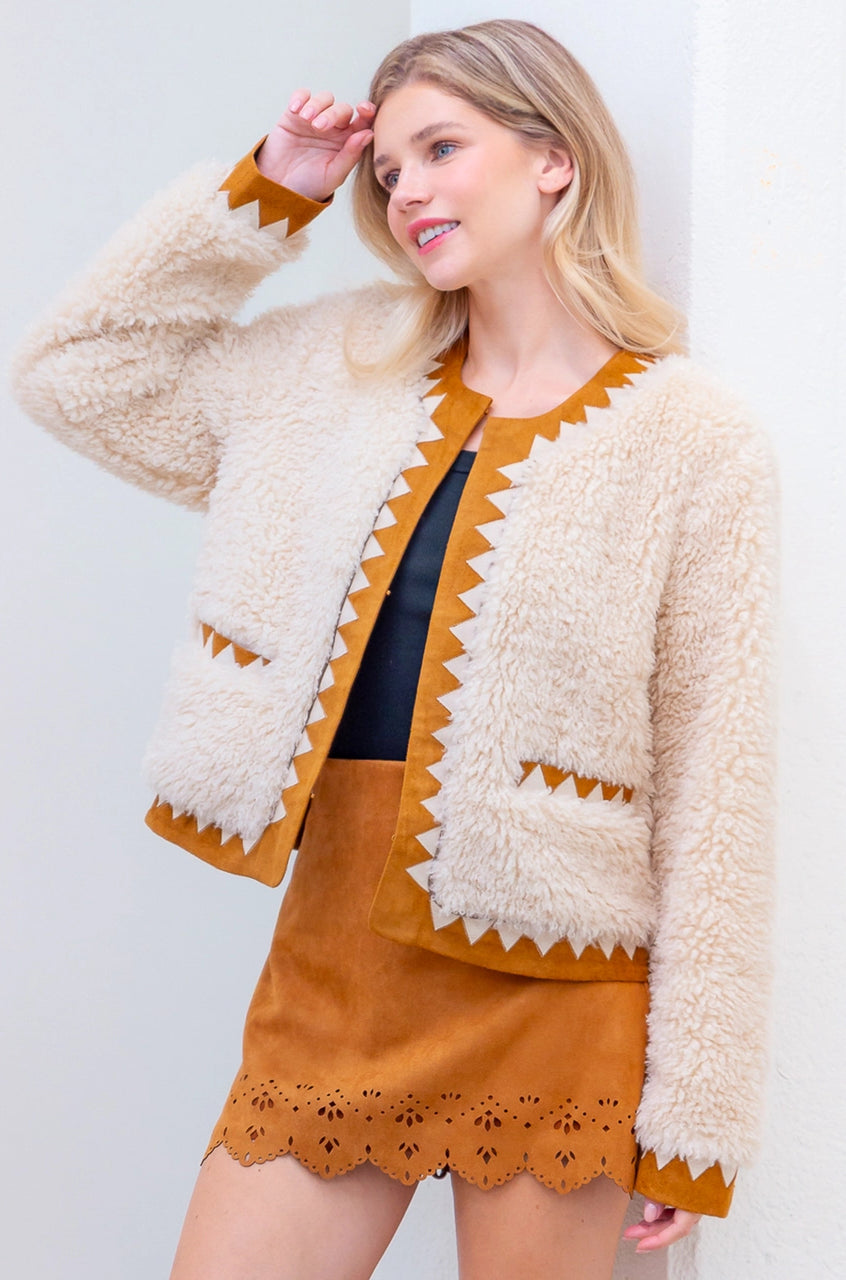 Front view of taupe Western sherpa jacket with zig-zag faux-suede trim on model