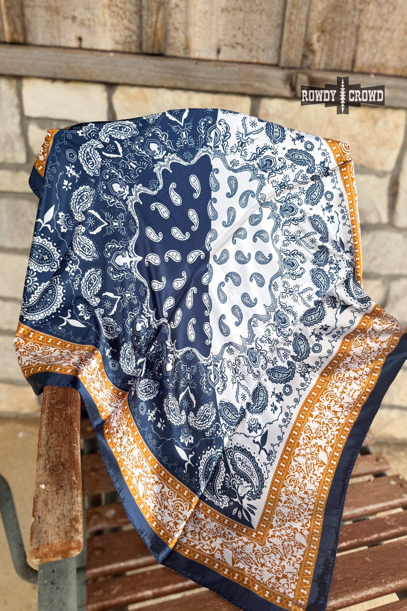 Blue and white patterned fabric draped over a wooden surface with 'Cowboy & Gordy' branding.