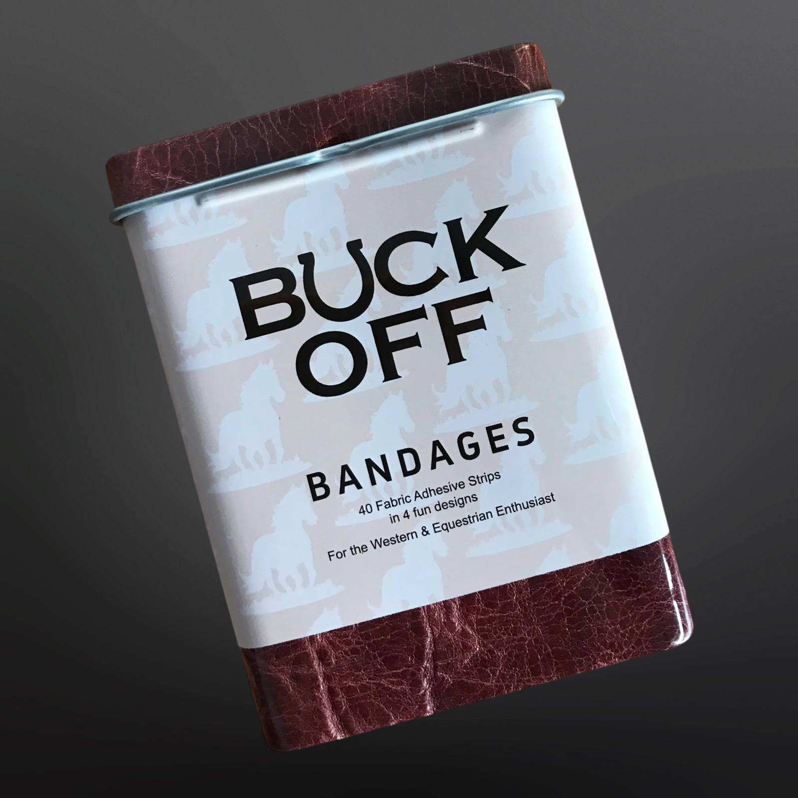 Can of Buck Off bandages with a brown lid and leather-like bottom on a dark background