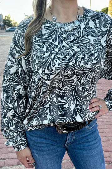 Black and white toole pattern on a ribbed long sleeve top