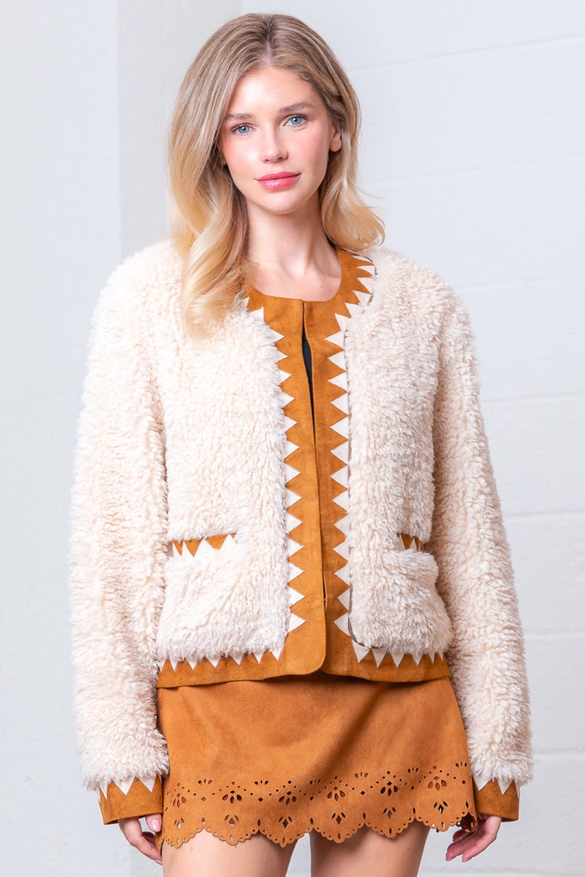 Front view of taupe Western sherpa jacket with zig-zag faux-suede trim on model