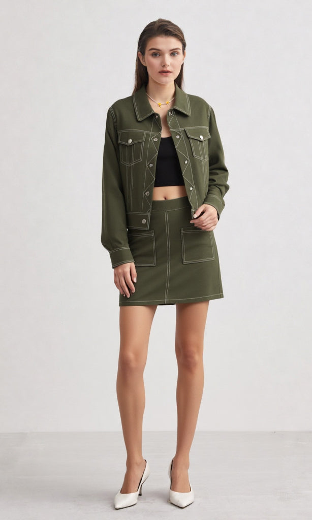 Woman wearing a green jacket and skirt on a white background