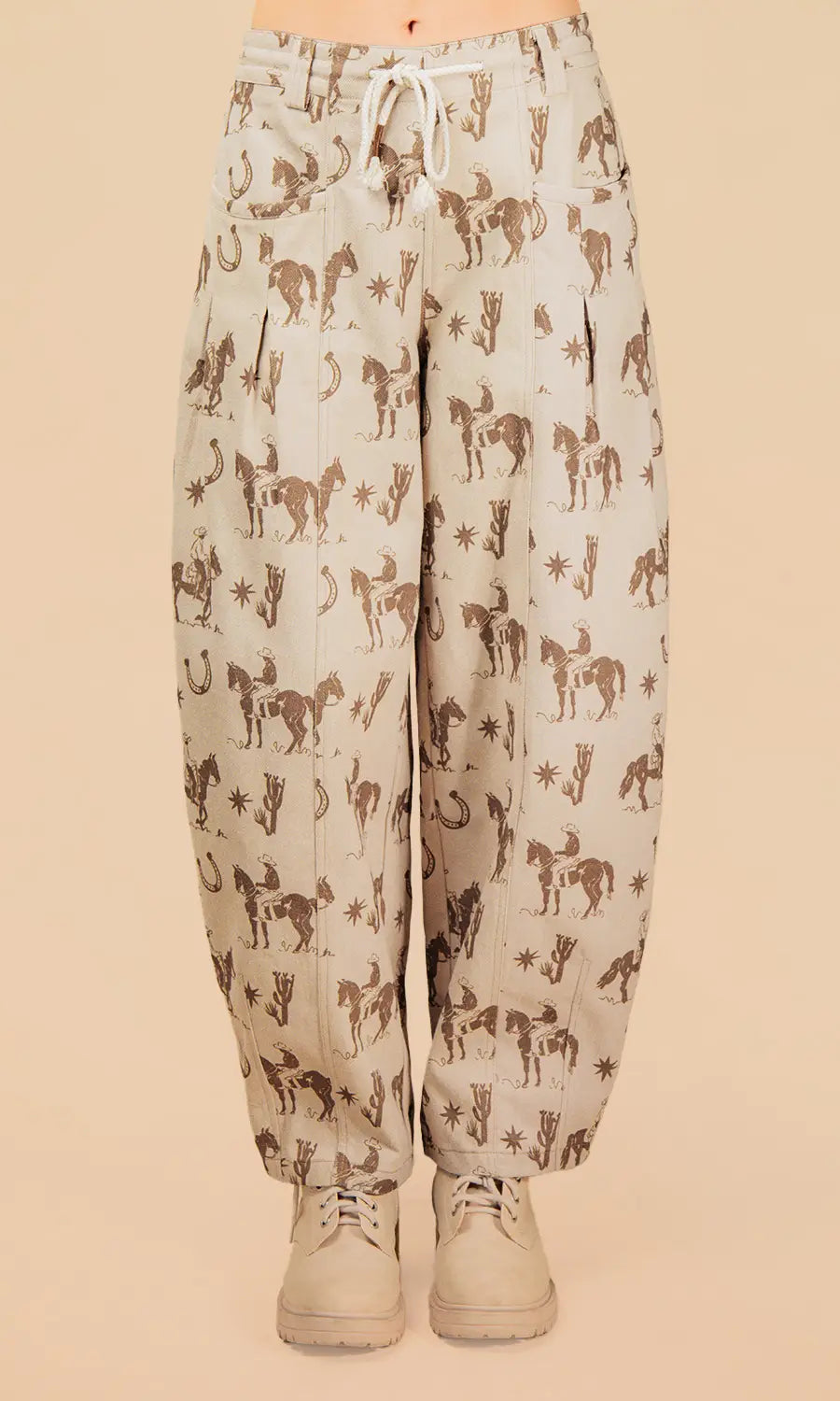 Light-colored pants with horse pattern on a beige background
