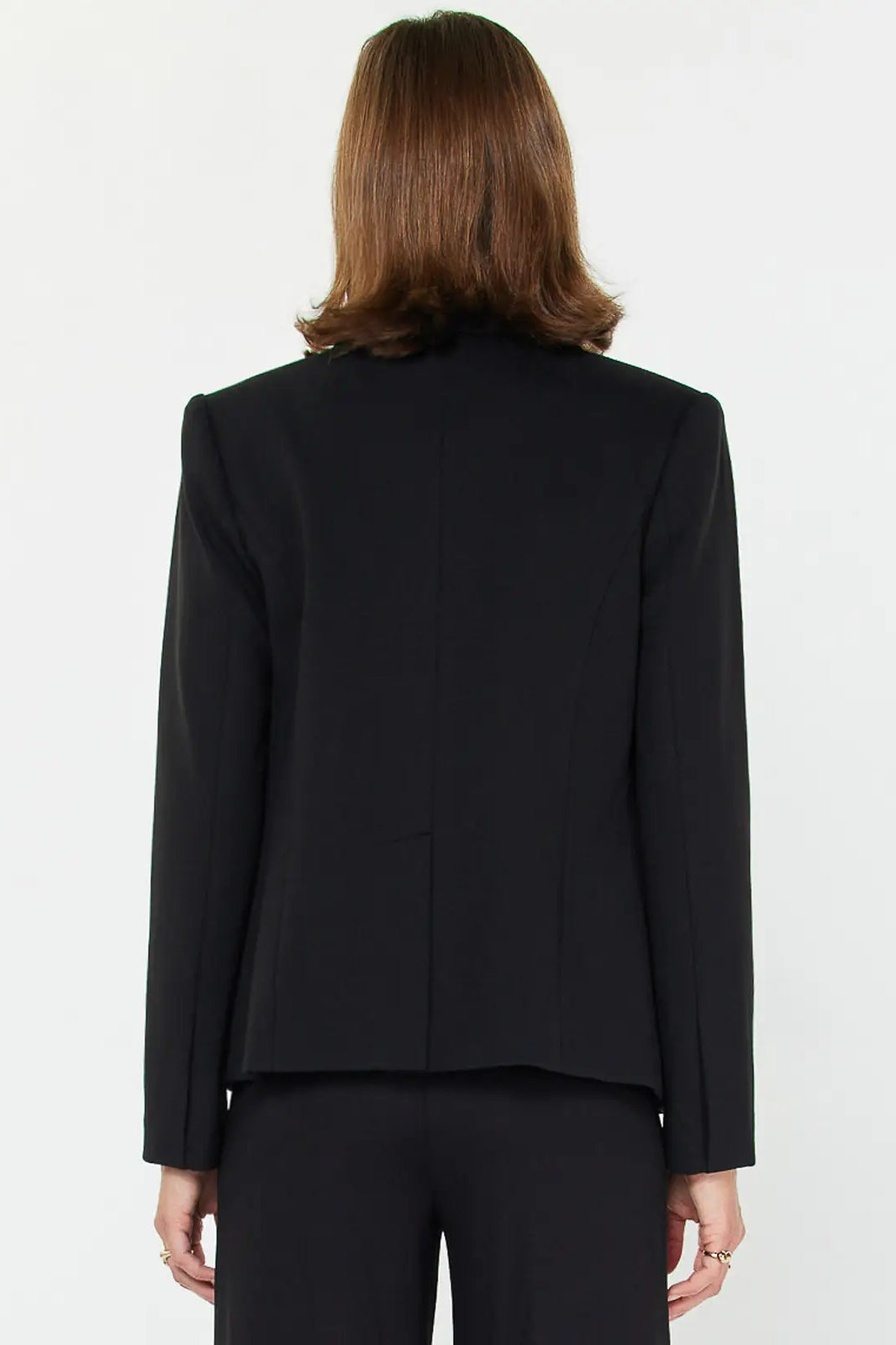 Back of Person wearing a black blazer on a white background