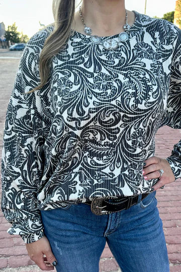 Black and white toole pattern on a ribbed long sleeve top