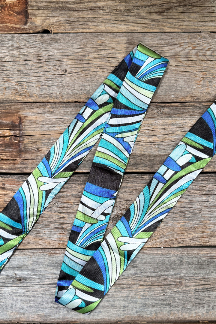 Patterned thin scarf on a wooden surface