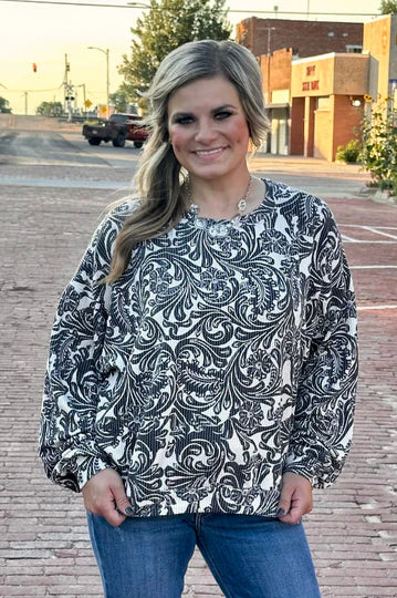 Black and white toole pattern on a ribbed long sleeve top