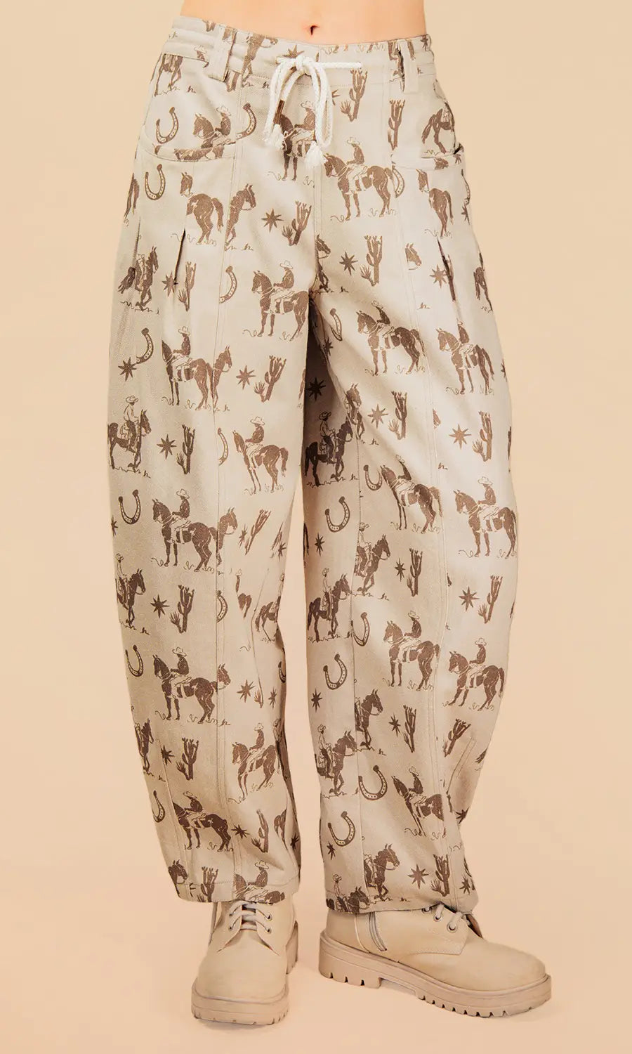 Pants with horse pattern worn by a person on a beige background