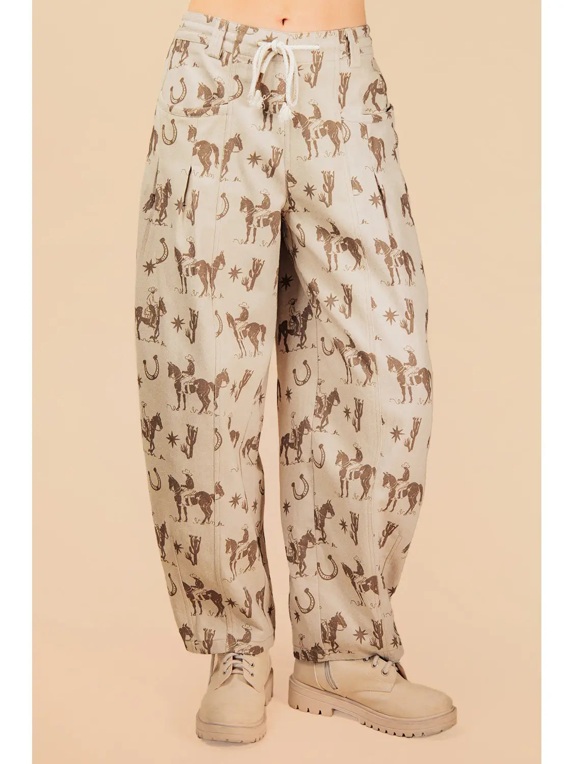 Pants with horse pattern worn by a person on a beige background