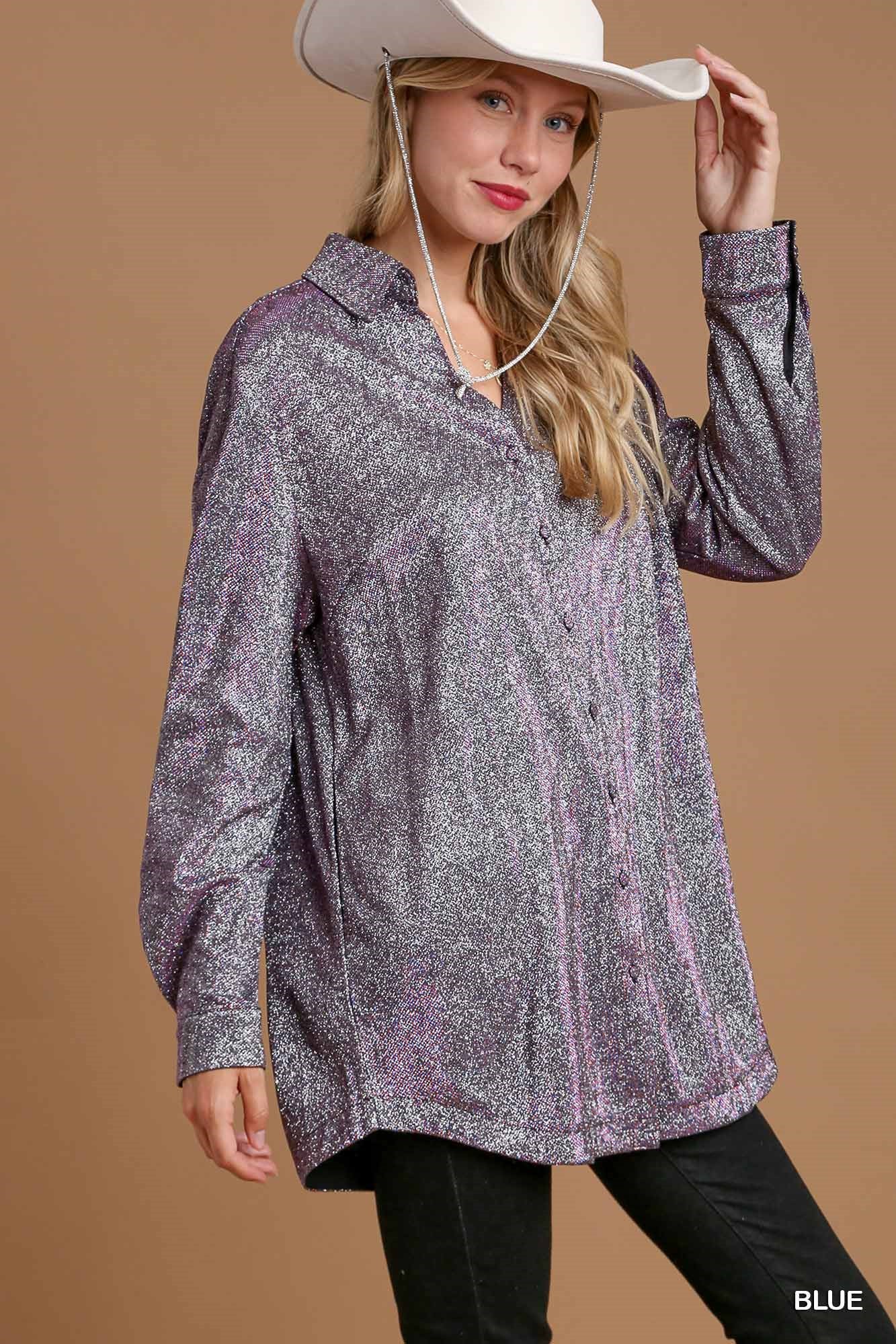 Woman wearing a patterned shirt and cowboy hat against a brown background