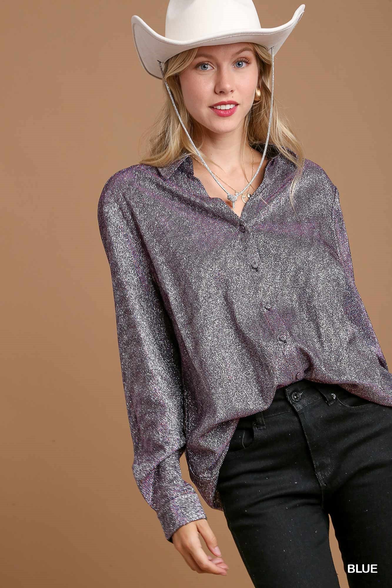 Woman wearing a sparkly silver shirt and white cowboy hat on a brown background