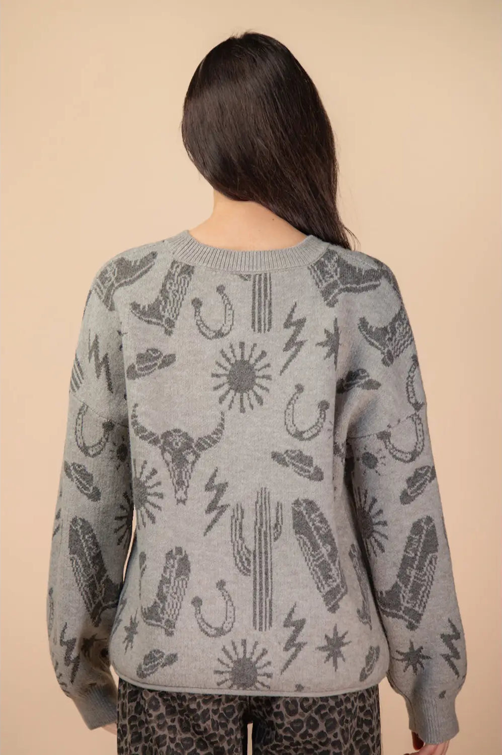 Back view of grey oversized knit sweater with rib hem and cuffs