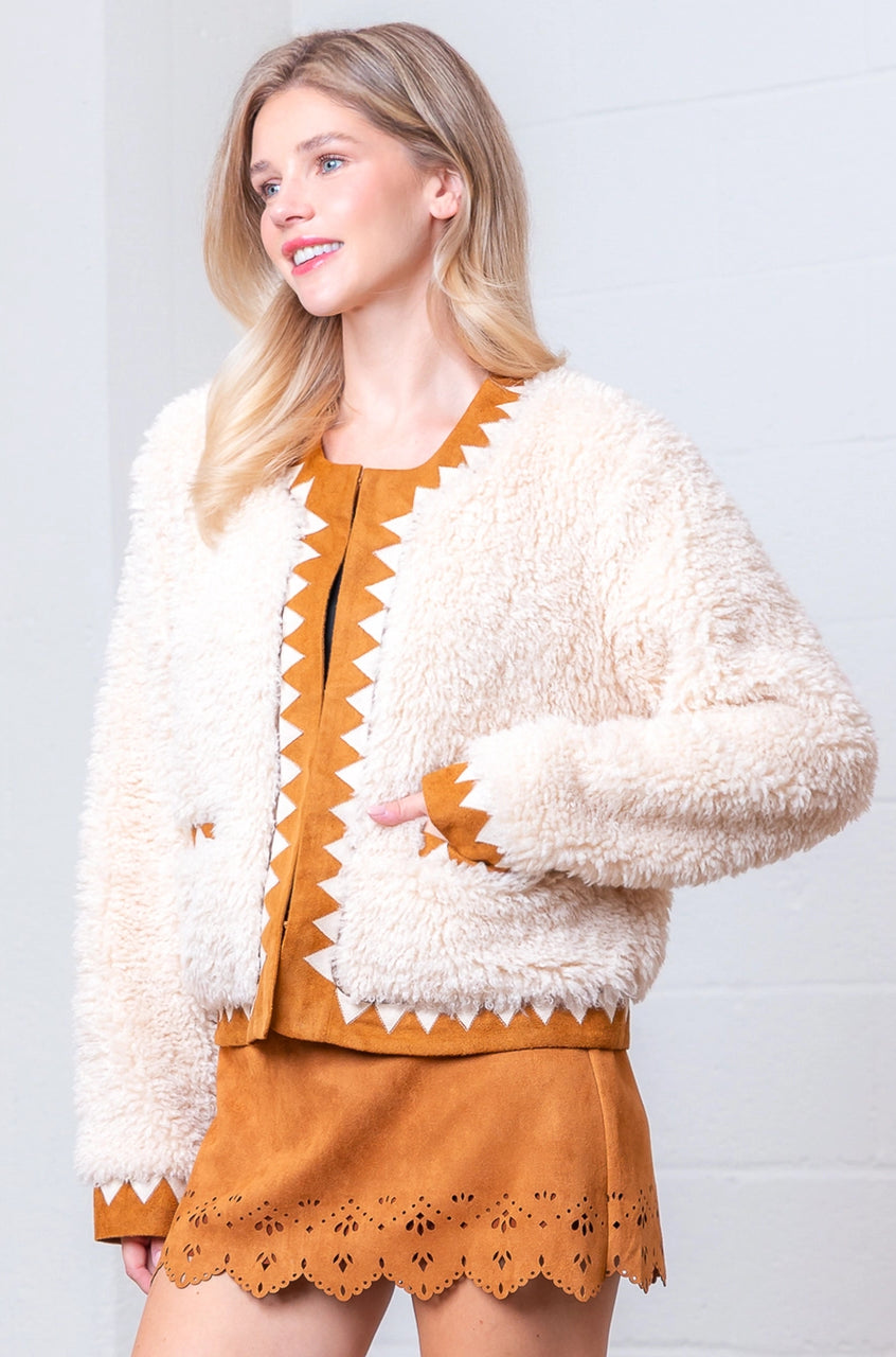 Front view of taupe Western sherpa jacket with zig-zag faux-suede trim on model