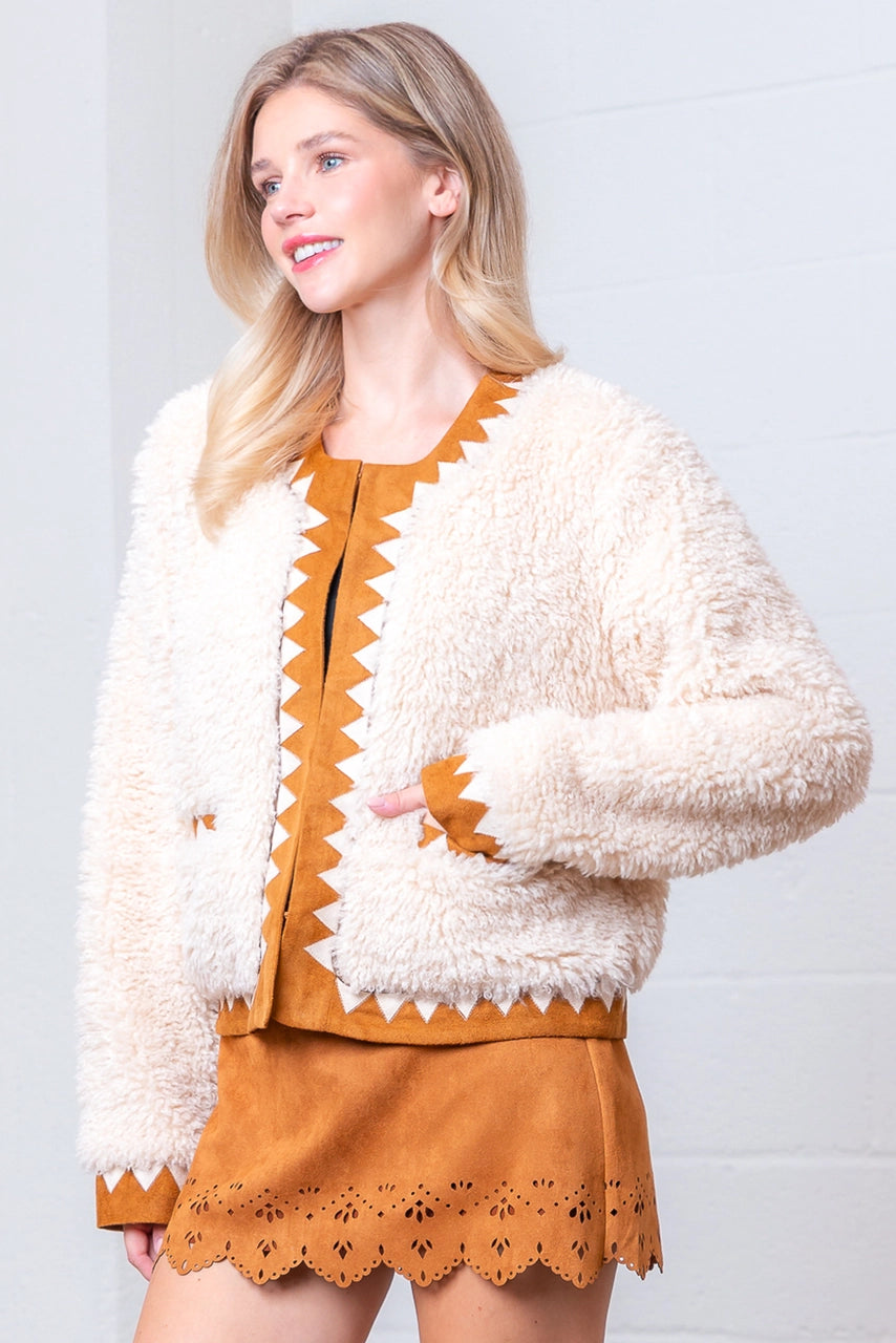 Front view of taupe Western sherpa jacket with zig-zag faux-suede trim on model