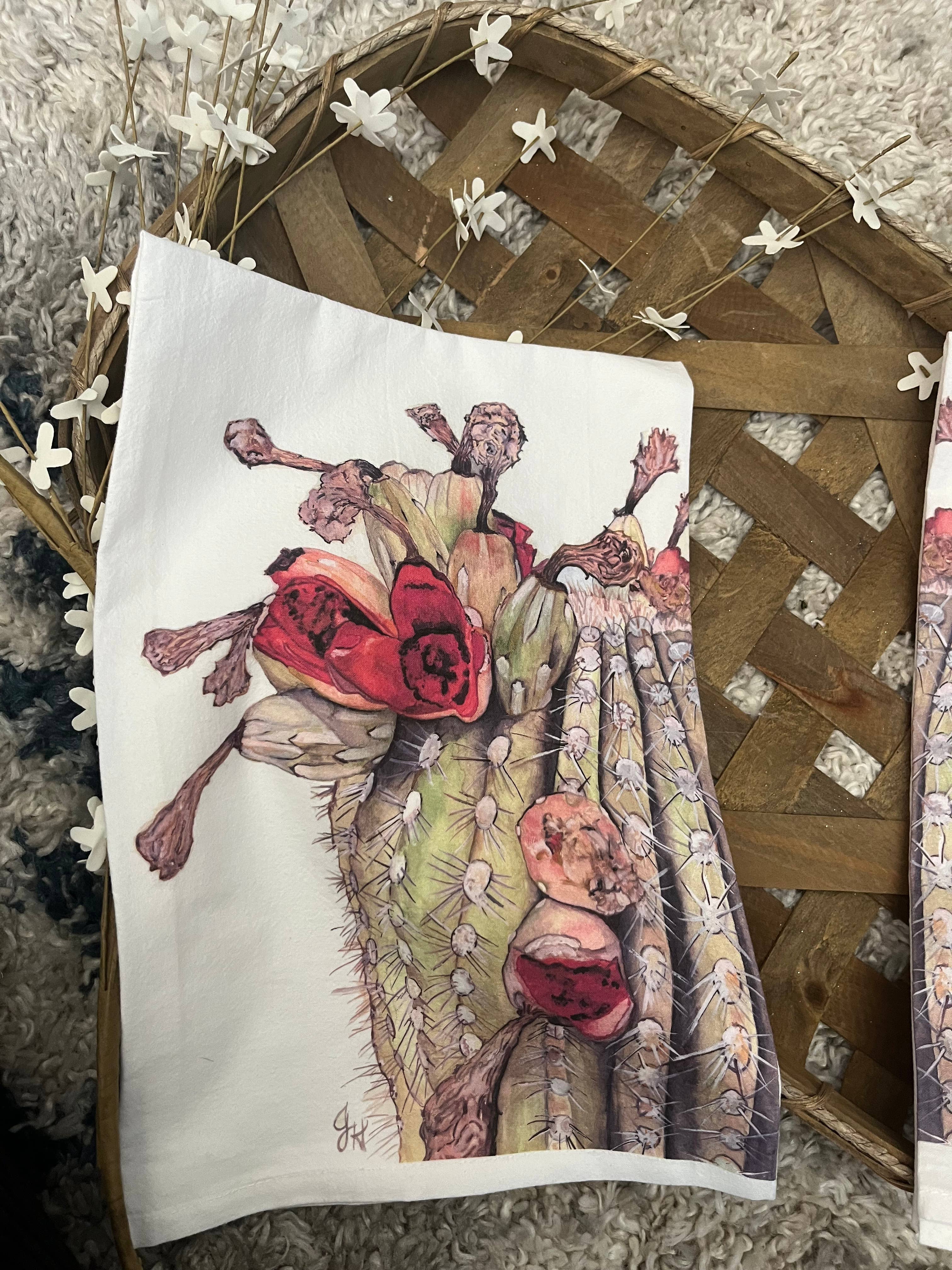 Towel with a cactus and flower design on a textured surface