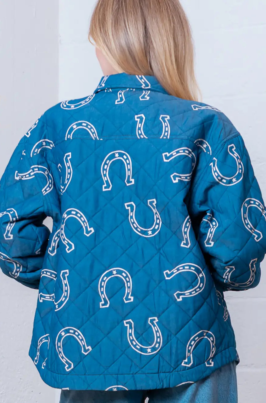 Back view highlighting overall horseshoe pattern on blue quilted coat.