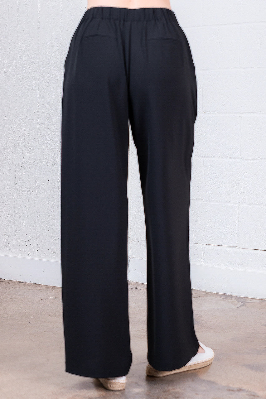 Black wide-leg pants on a neutral background