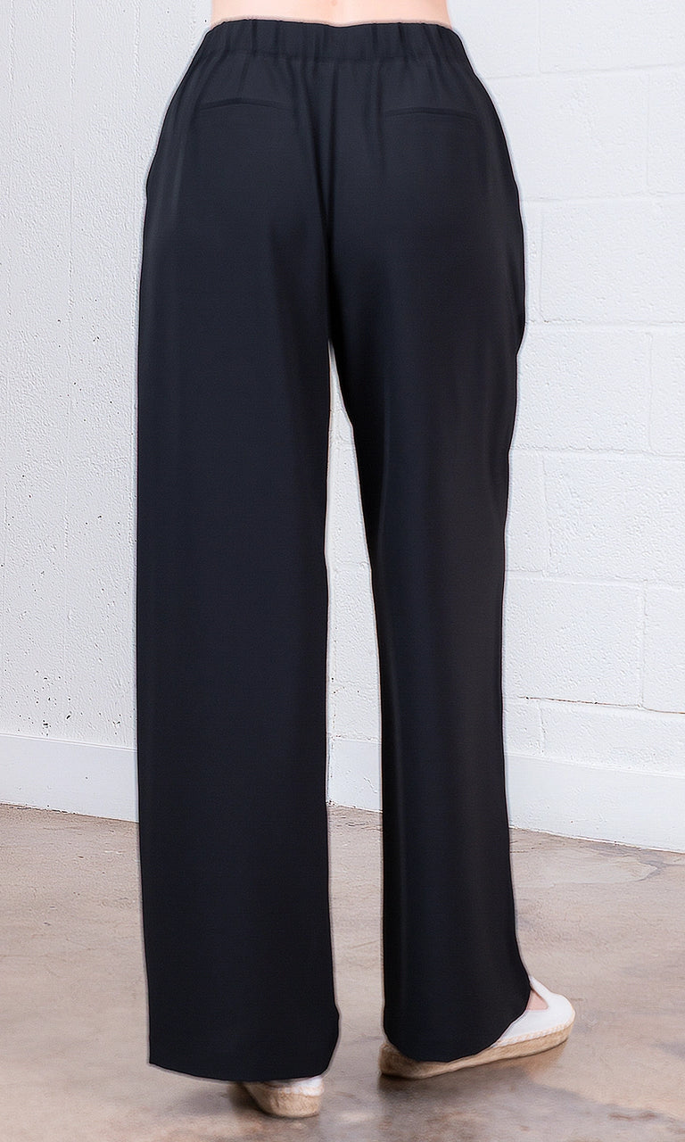 Black wide-leg pants on a neutral background
