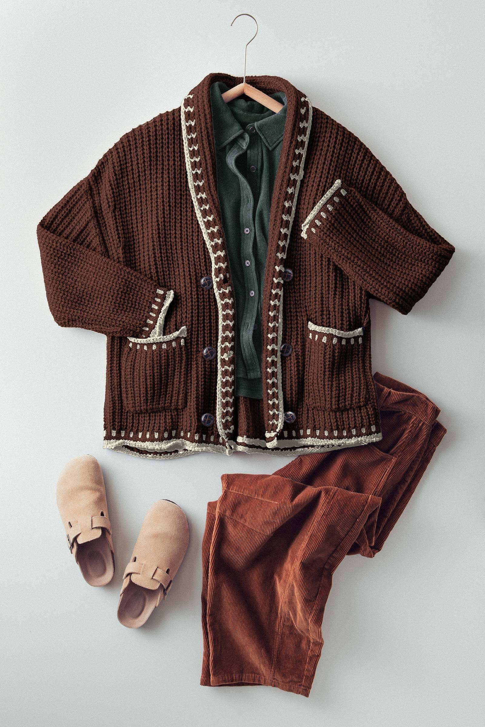 Brown knitted cardigan, green shirt, brown pants, and beige slippers on a light gray background
