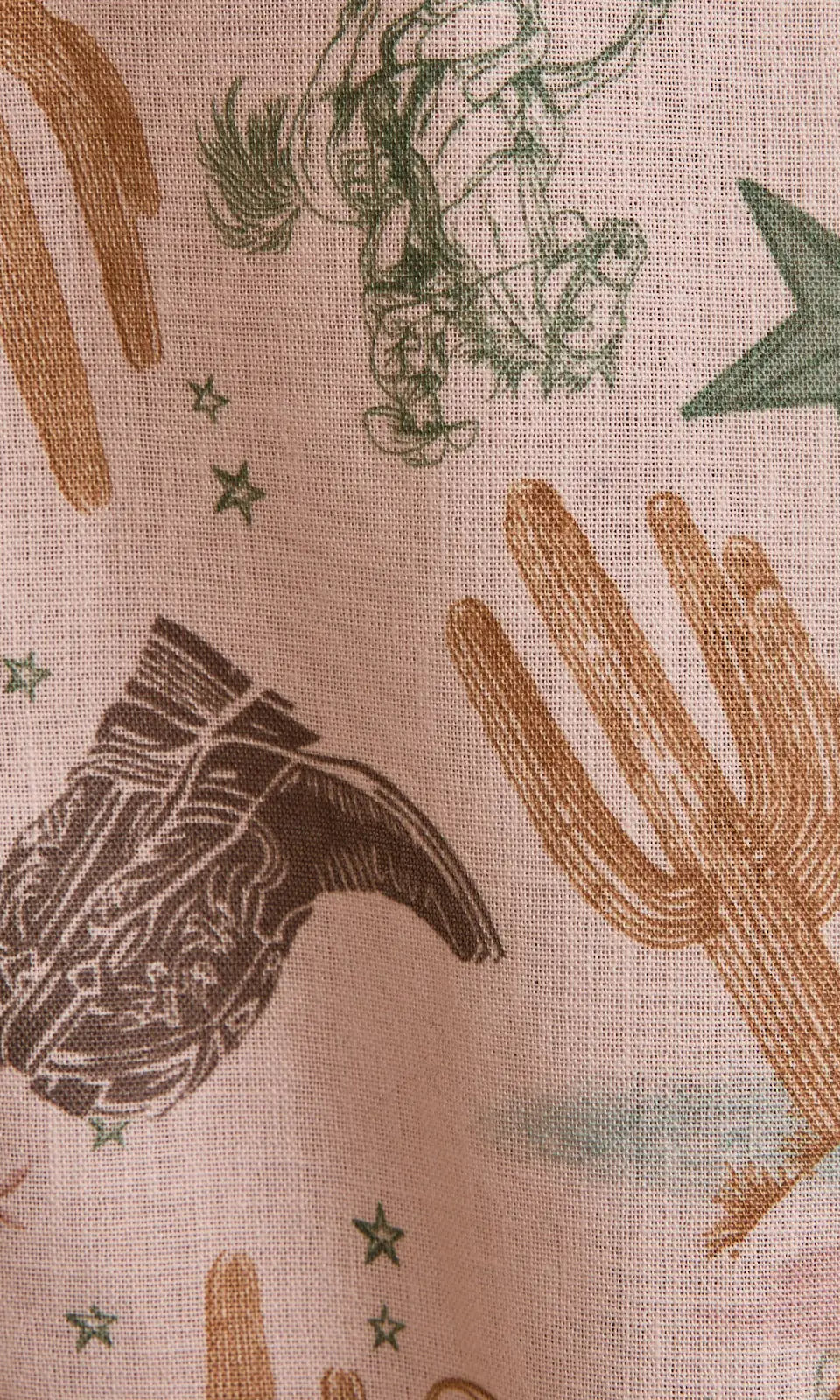 Close-up of cactus, boots, horseshoes, lasso, stars print—Desert Rose pants