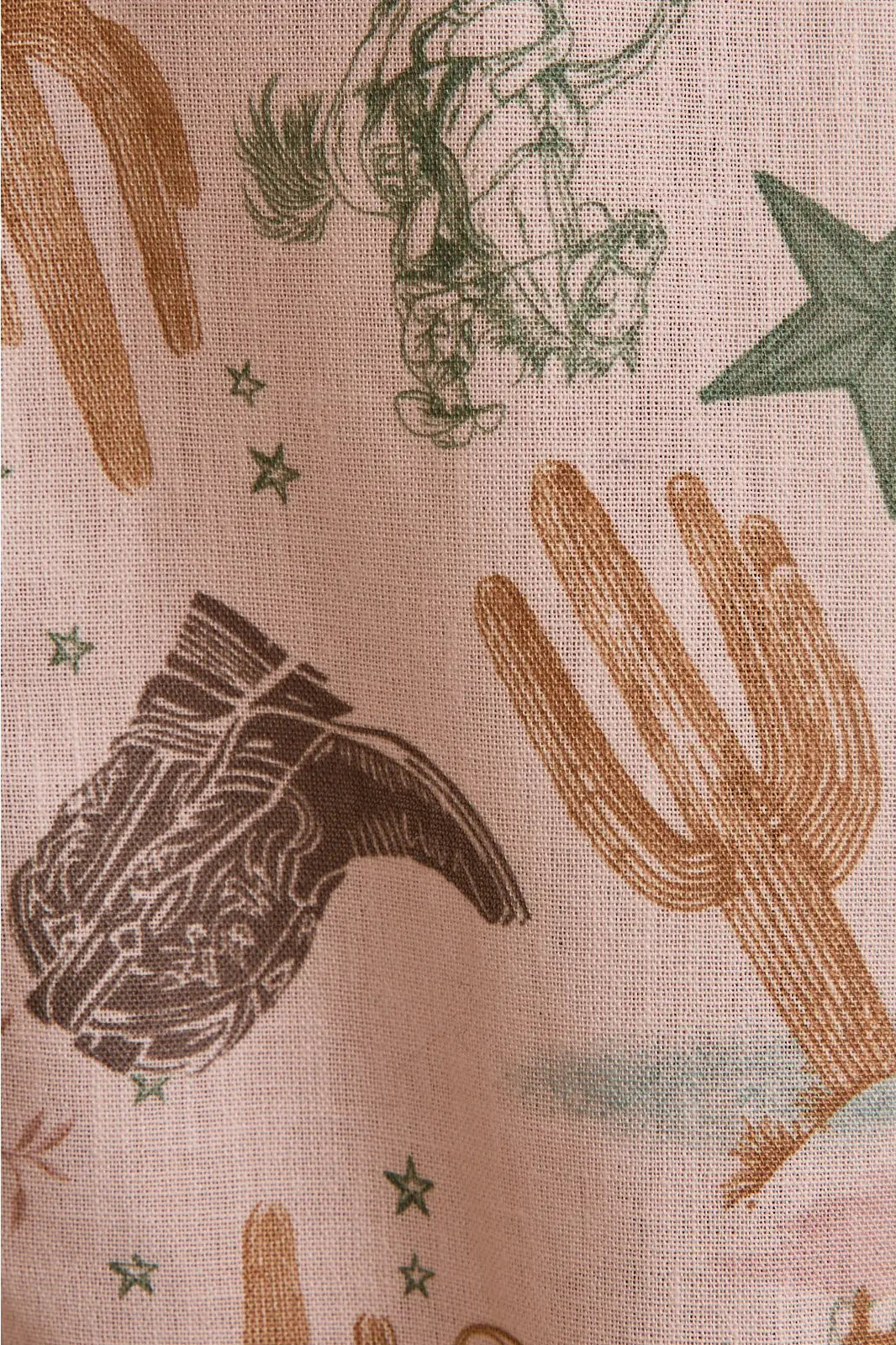 Close-up of cactus, boots, horseshoes, lasso, stars print—Desert Rose pants
