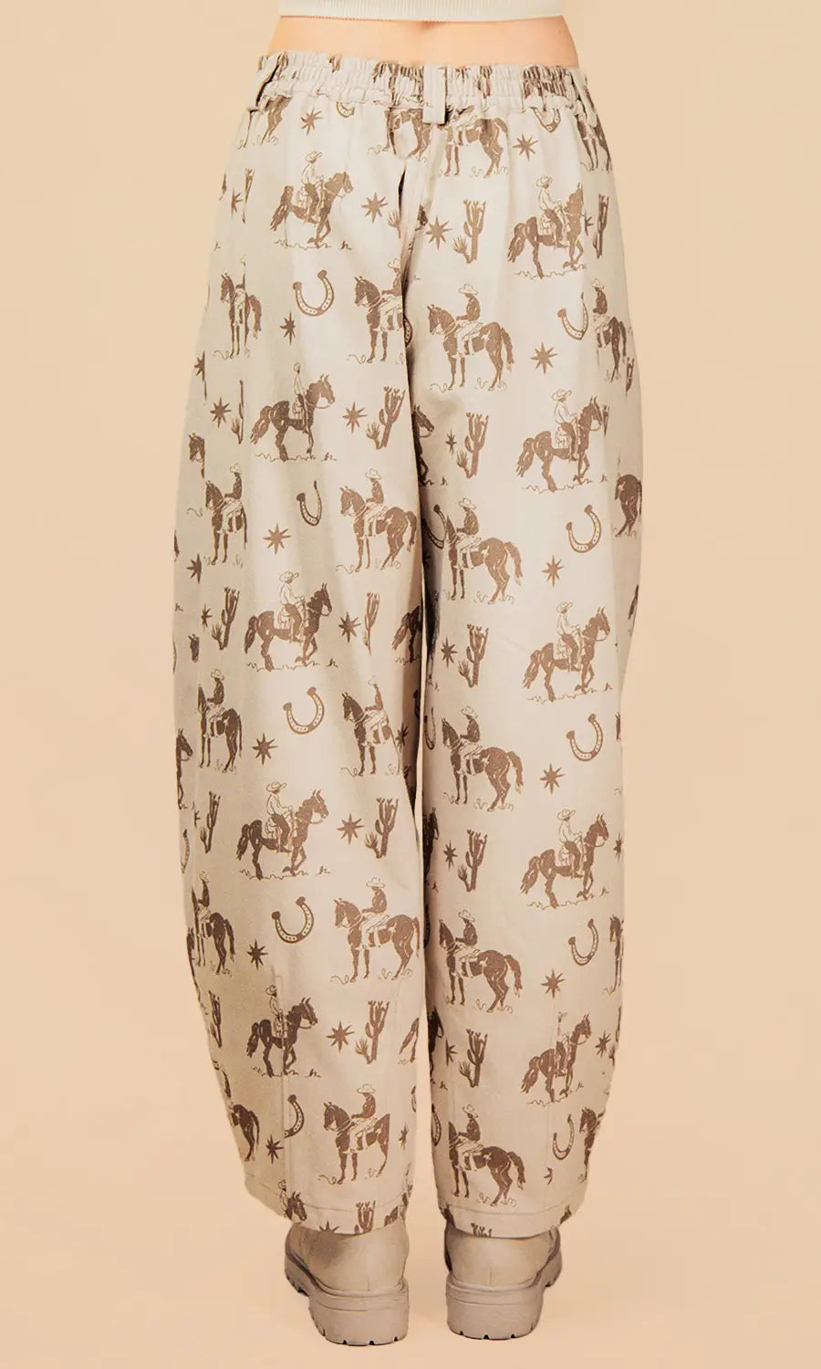 Beige pants with horse pattern on a beige background
