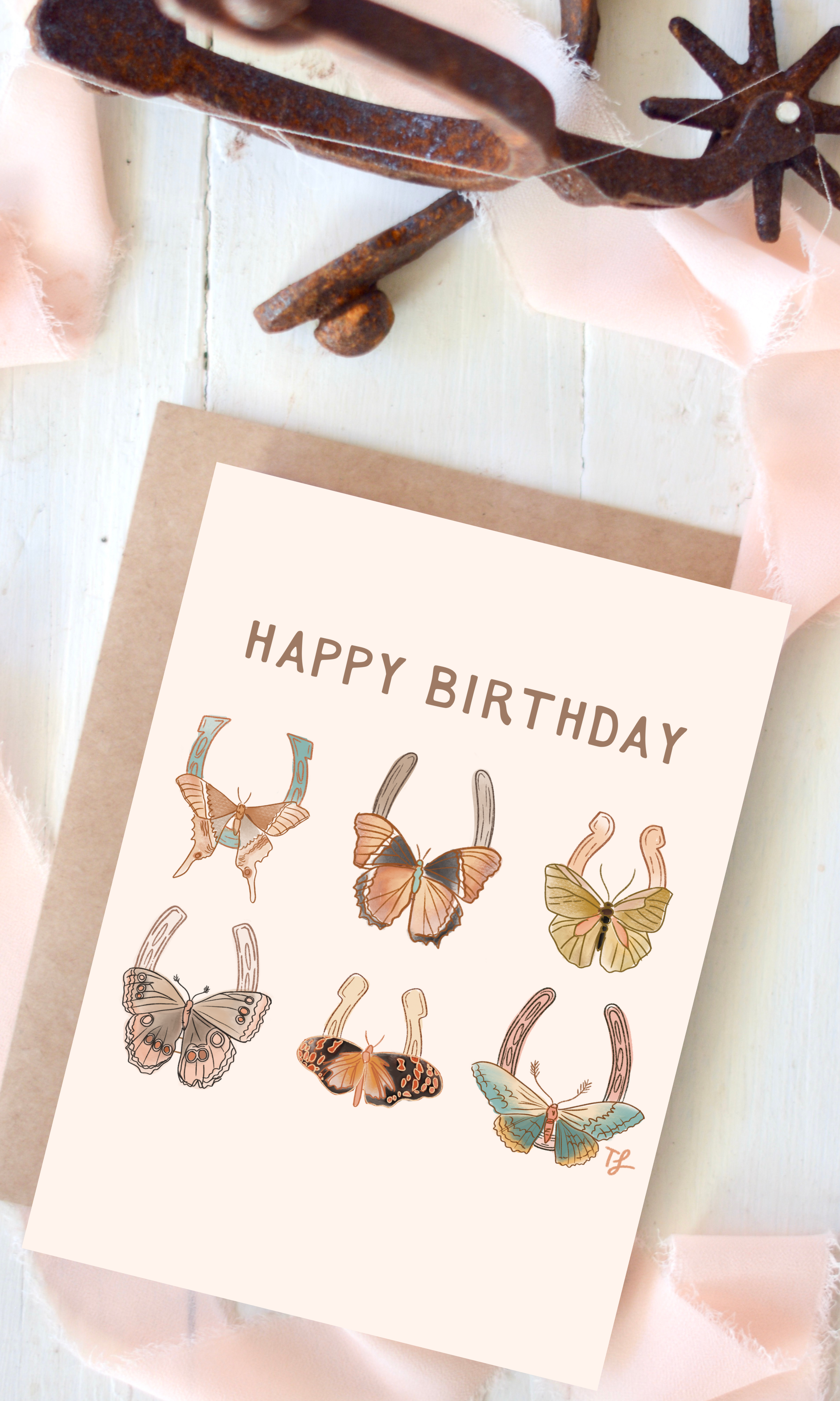 Birthday card with butterfly on horseshoes illustrations on a white background