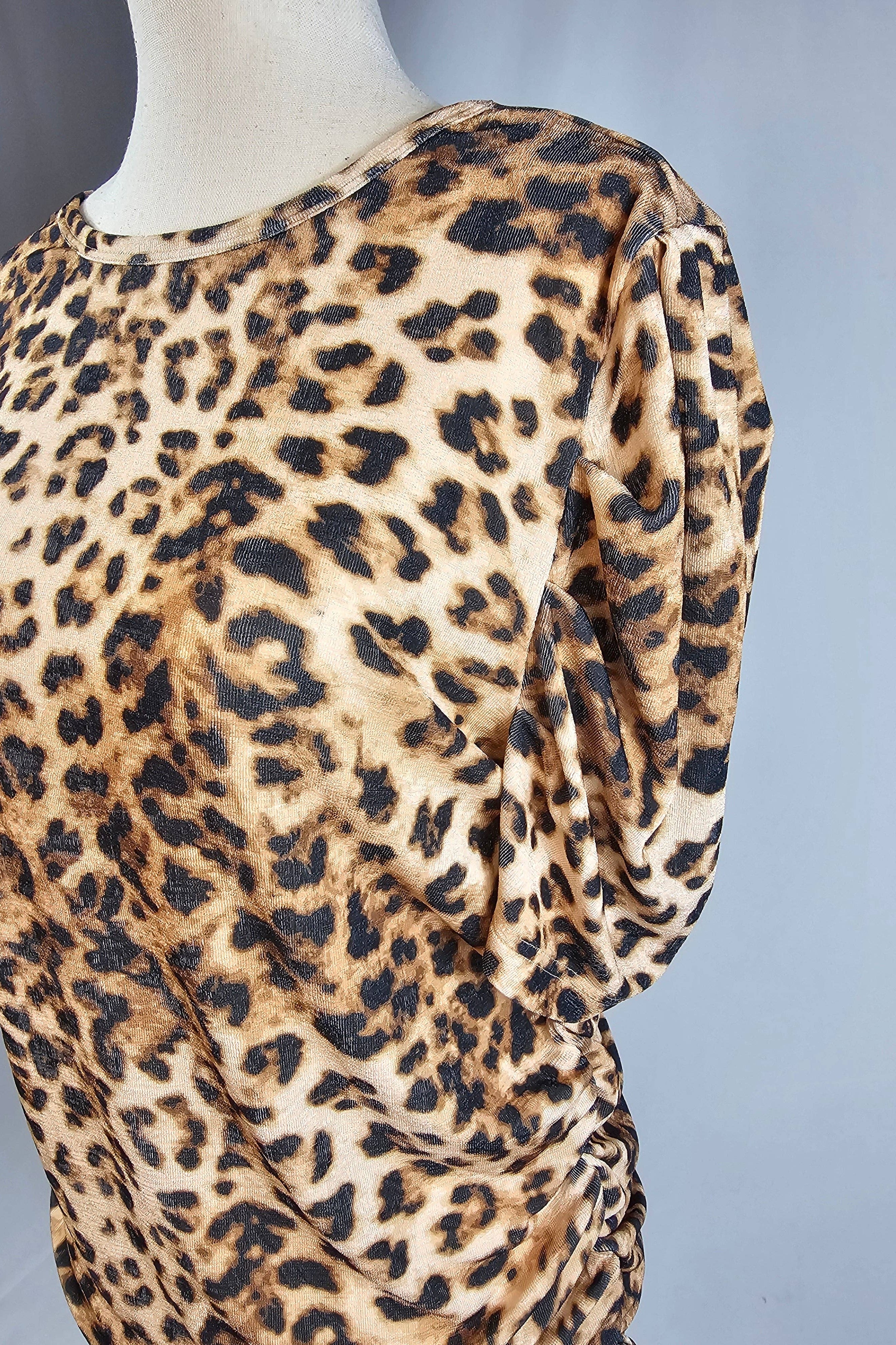 Leopard print dress on a mannequin against a gray background
