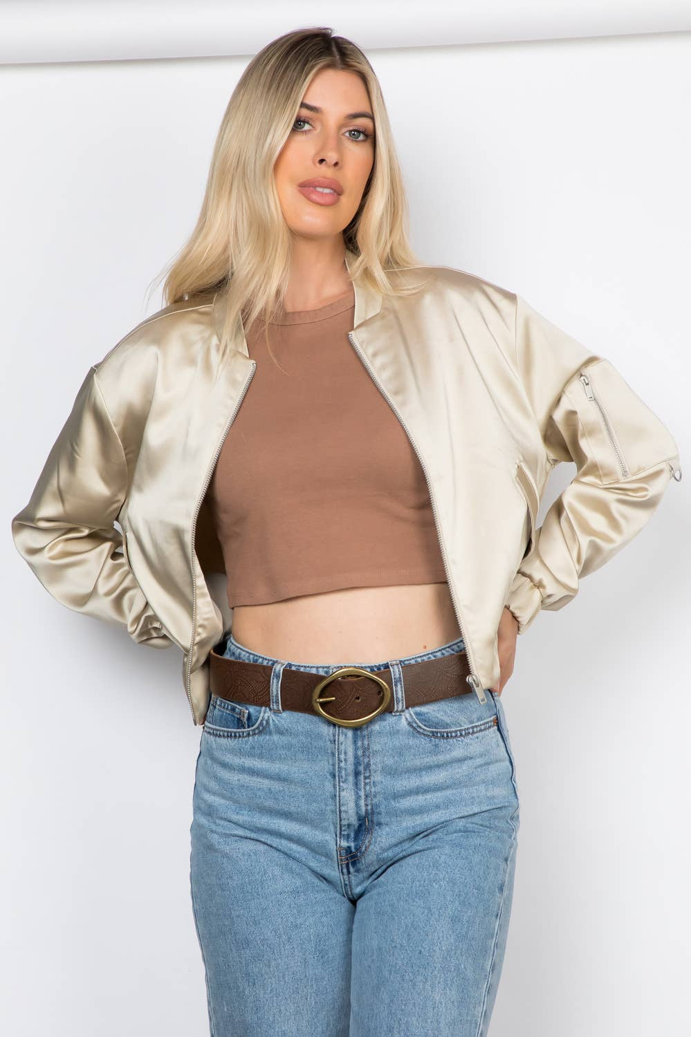 Lightweight satin bomber jacket featuring a relaxed fit, full front zipper, elastic cuffs, fully lined construction, utility sleeve pocket, and side pockets for polished everyday layering.