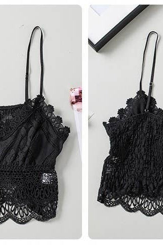 Black lace bralette laying on a table