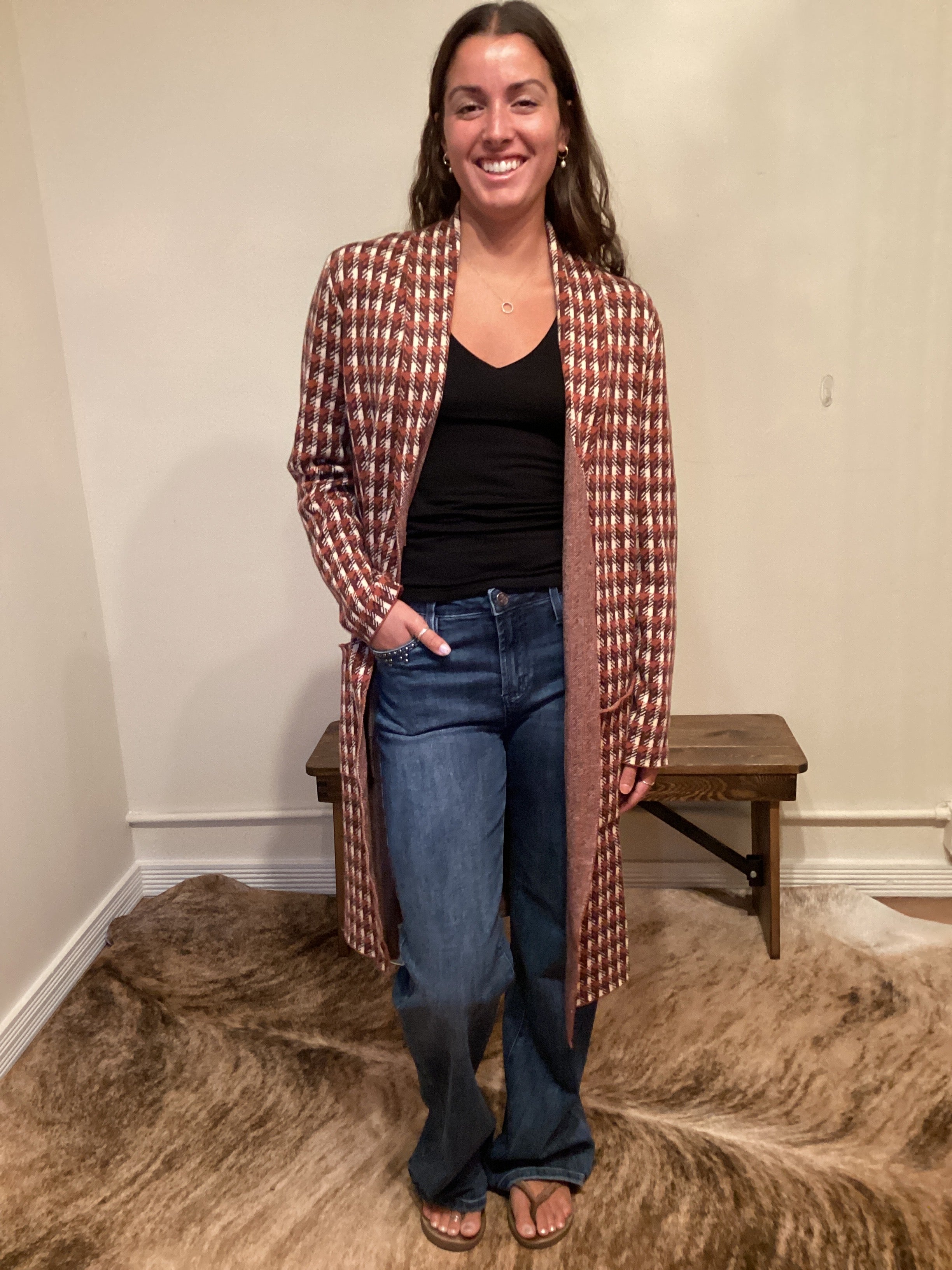 Rust and brown check pattern long cardigan with a single button and pockets hits mid shin