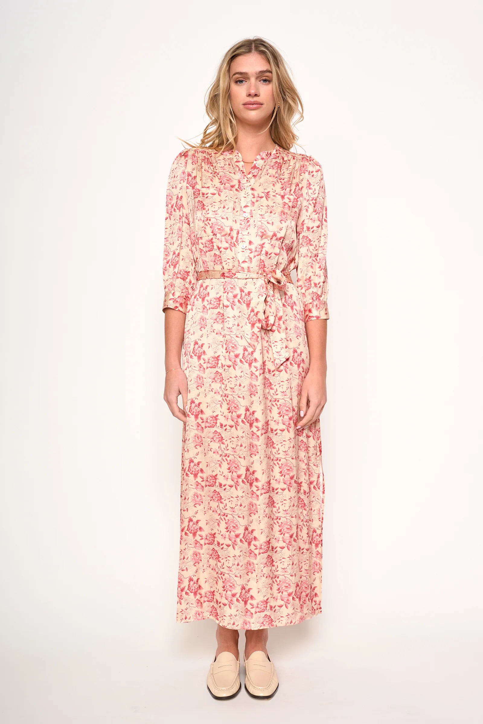 Woman wearing a floral dress on a white background