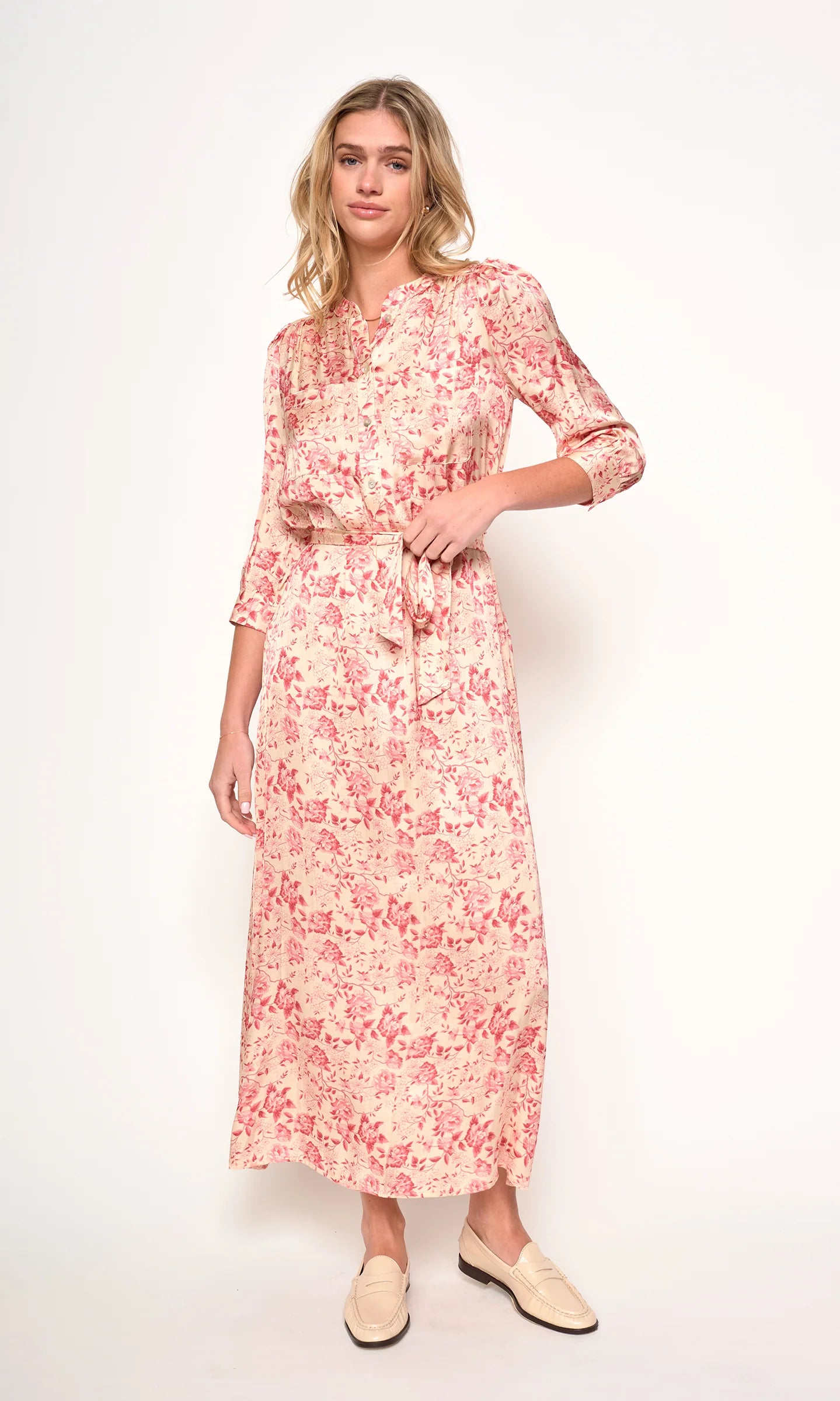 Woman wearing a floral dress on a white background