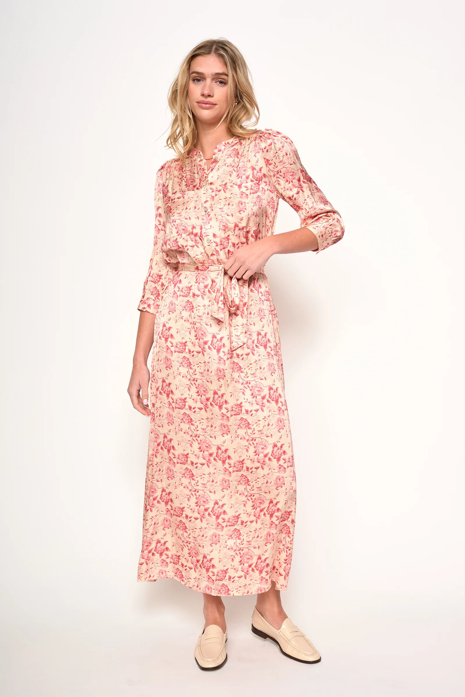 Woman wearing a floral dress on a white background