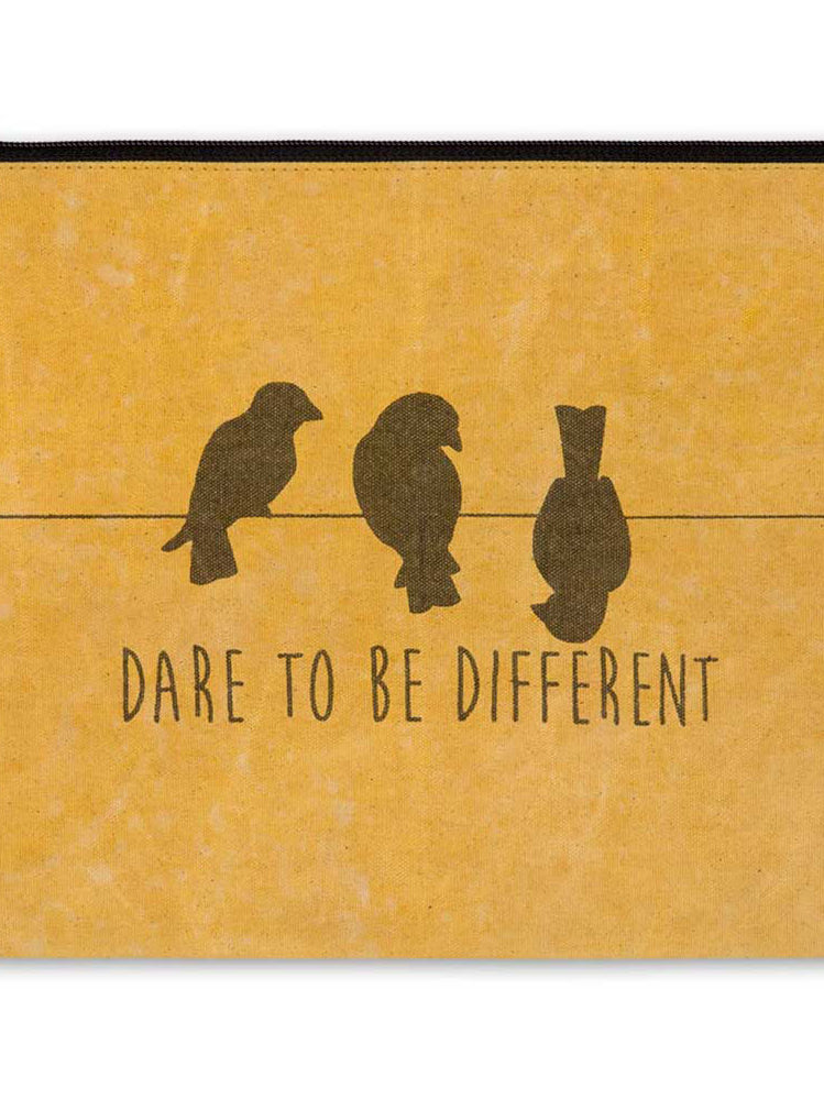Pouch with birds on a wire design and 'Dare to Be Different' text in black on a mustard yellow background