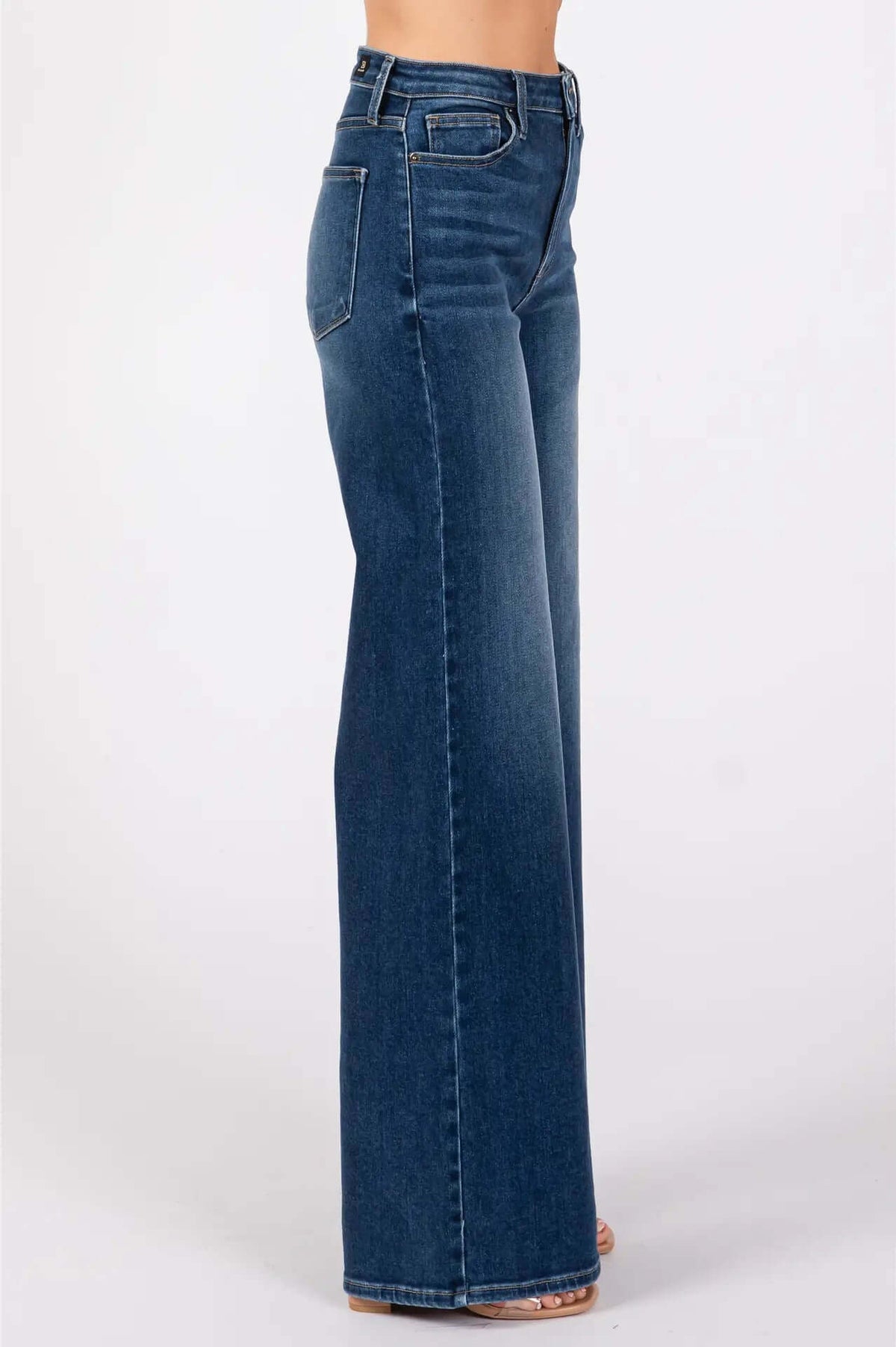 Dark denim jeans wide leg side view.