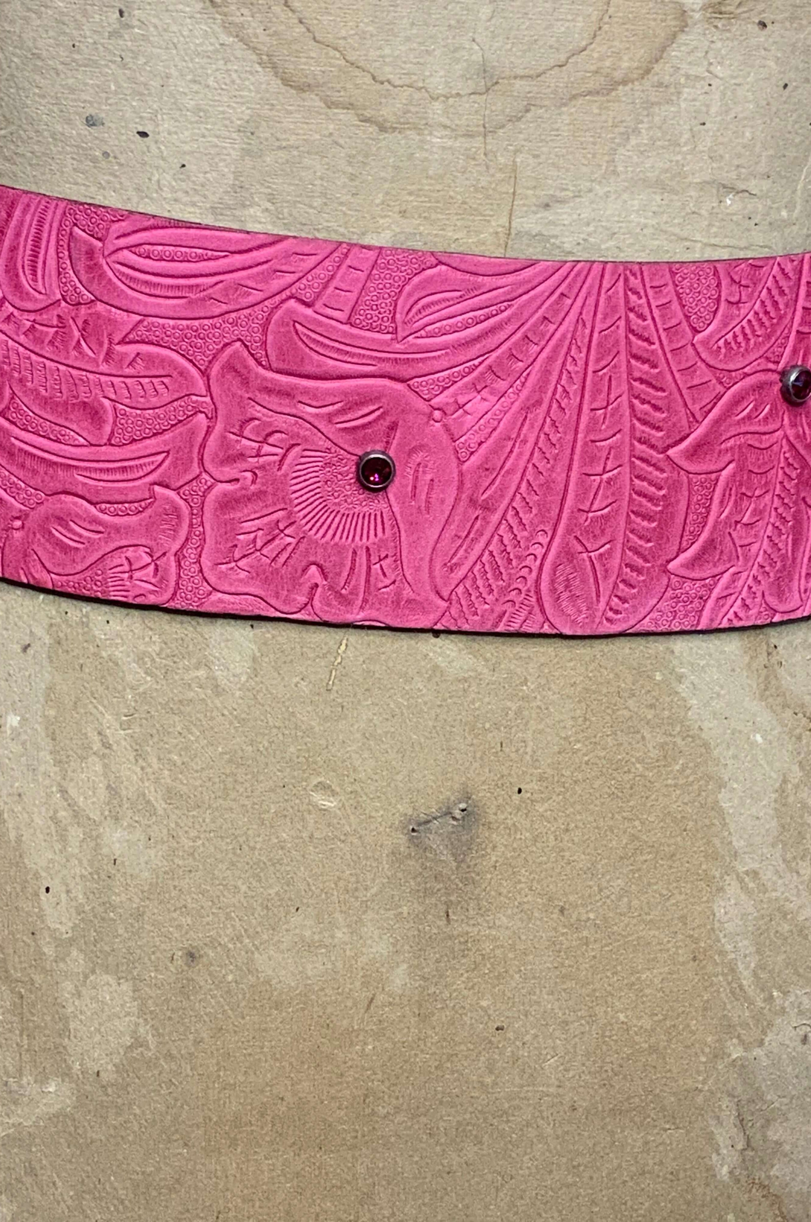 Close Up view of the Hot Pink embossed Leather with pink crystal spots in the leather