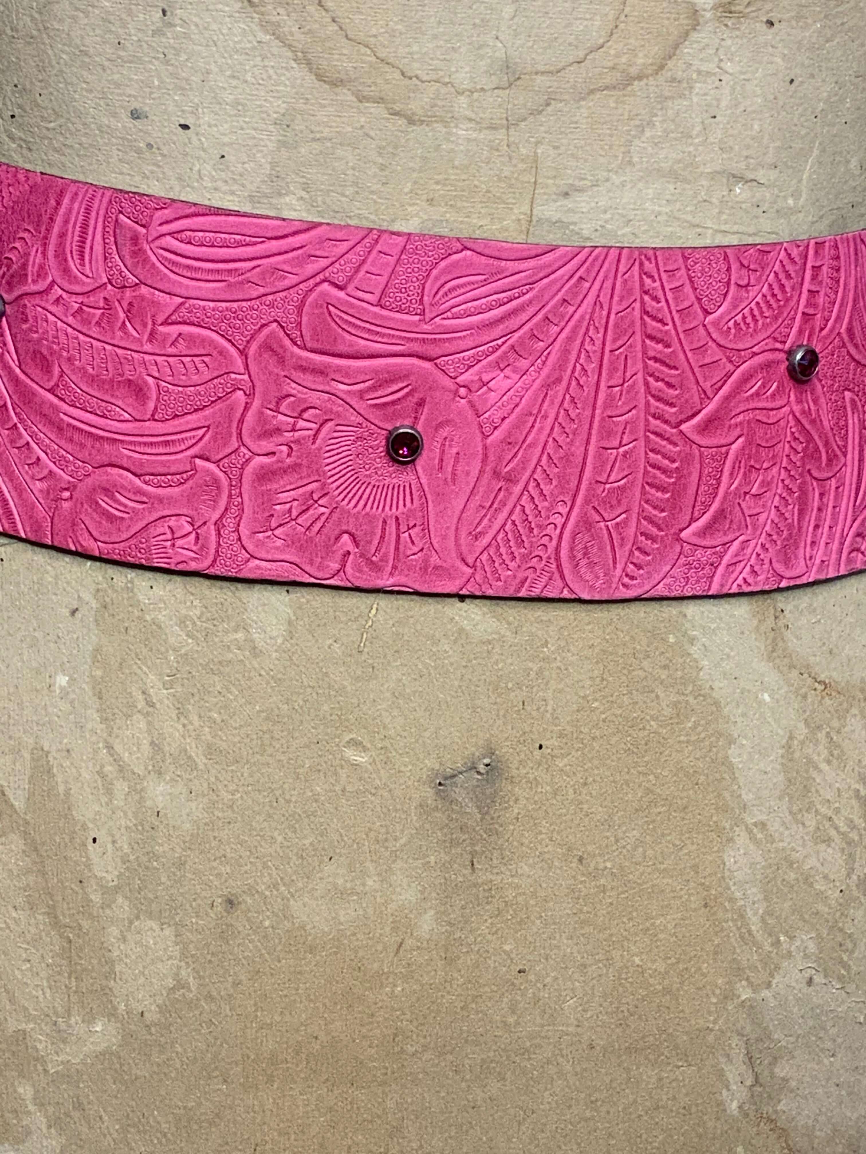 Close Up view of the Hot Pink embossed Leather with pink crystal spots in the leather