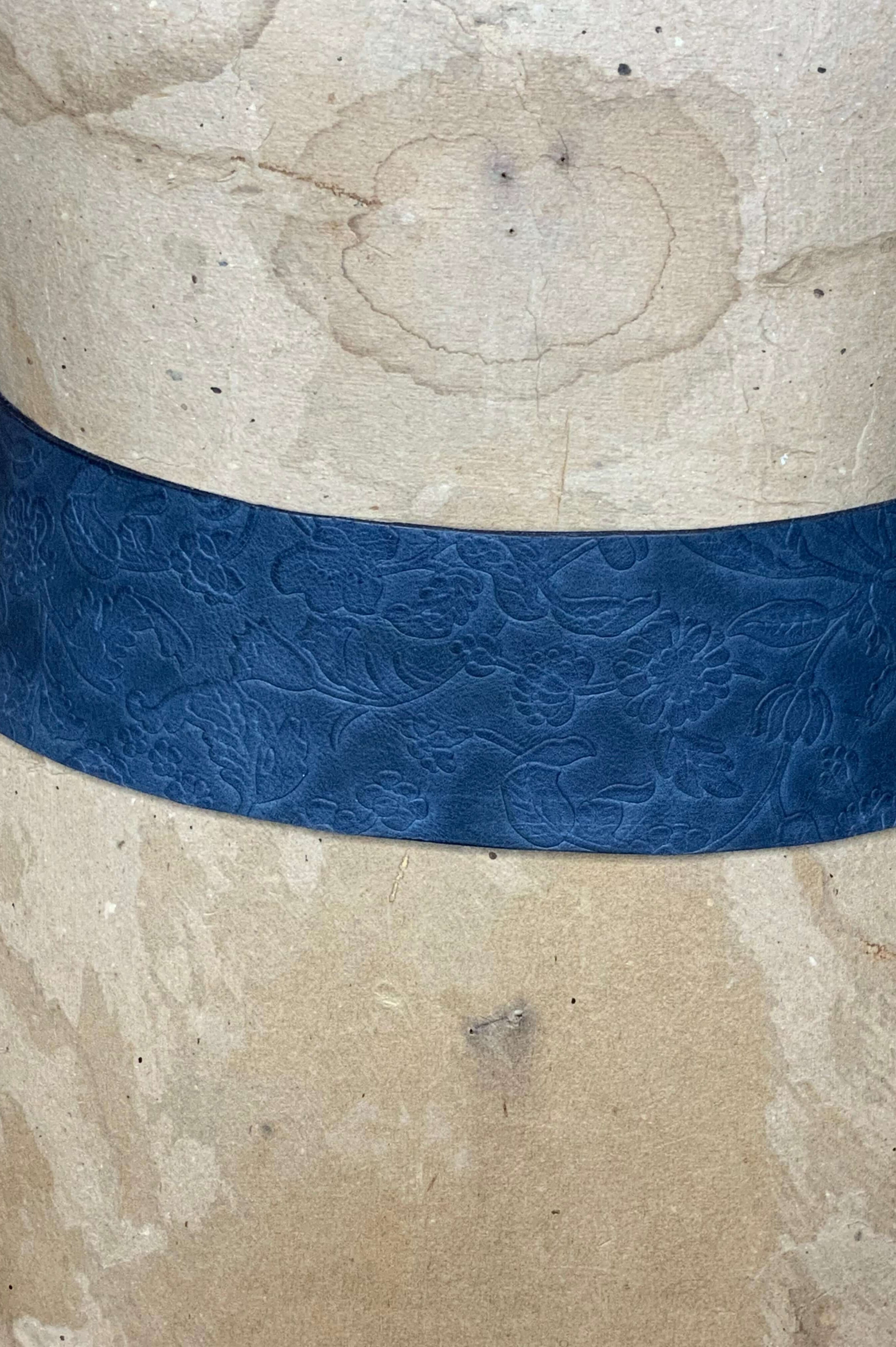 Navy Floral embossed close up of leather 3" wide belt.