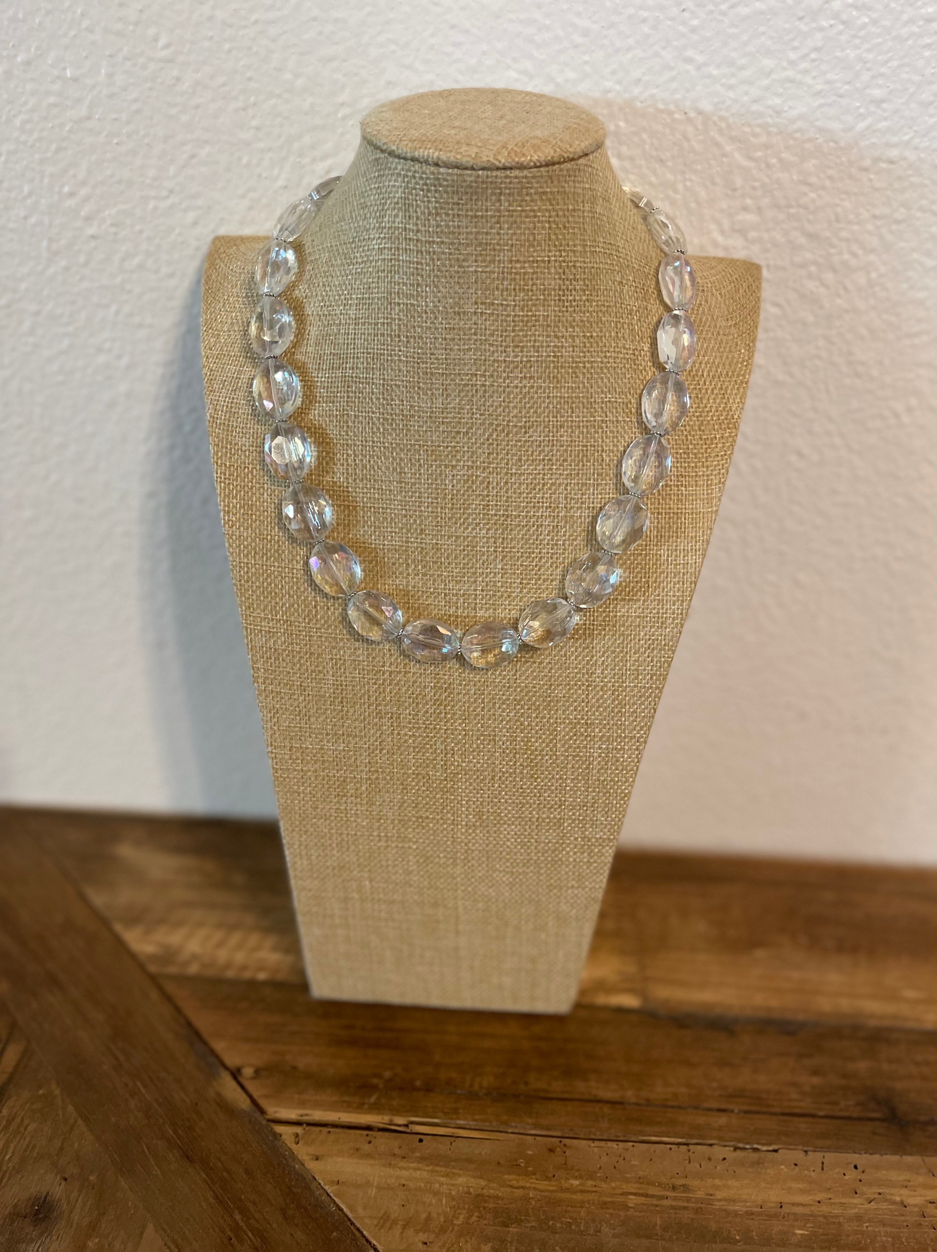 Clear crystal necklace with very simple silver spacers.