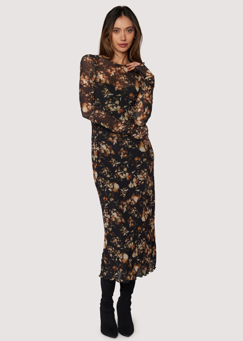 Woman wearing a floral dress on a white background