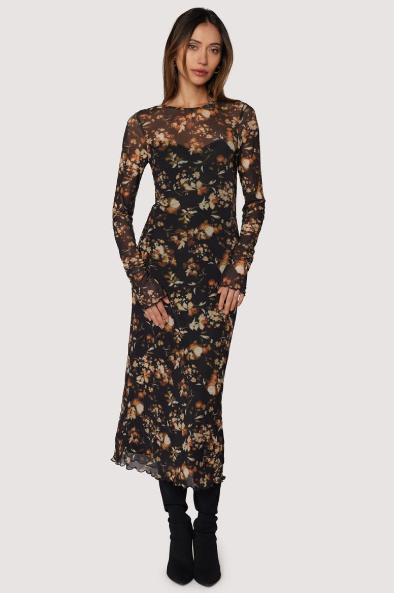 Woman wearing a floral dress on a white background