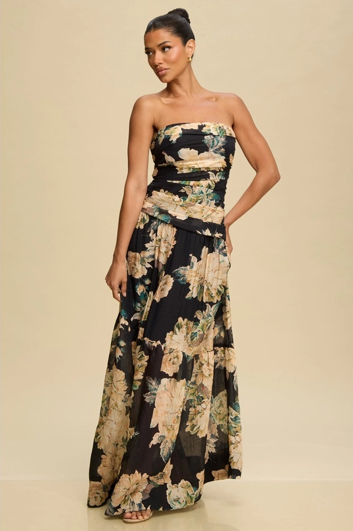 Woman wearing a strapless floral gown against a beige backgroundMagnolia Strapless Vintage Floral Maxi Dress – Black/Tan/Gold with Blue-Green Accents | Lined