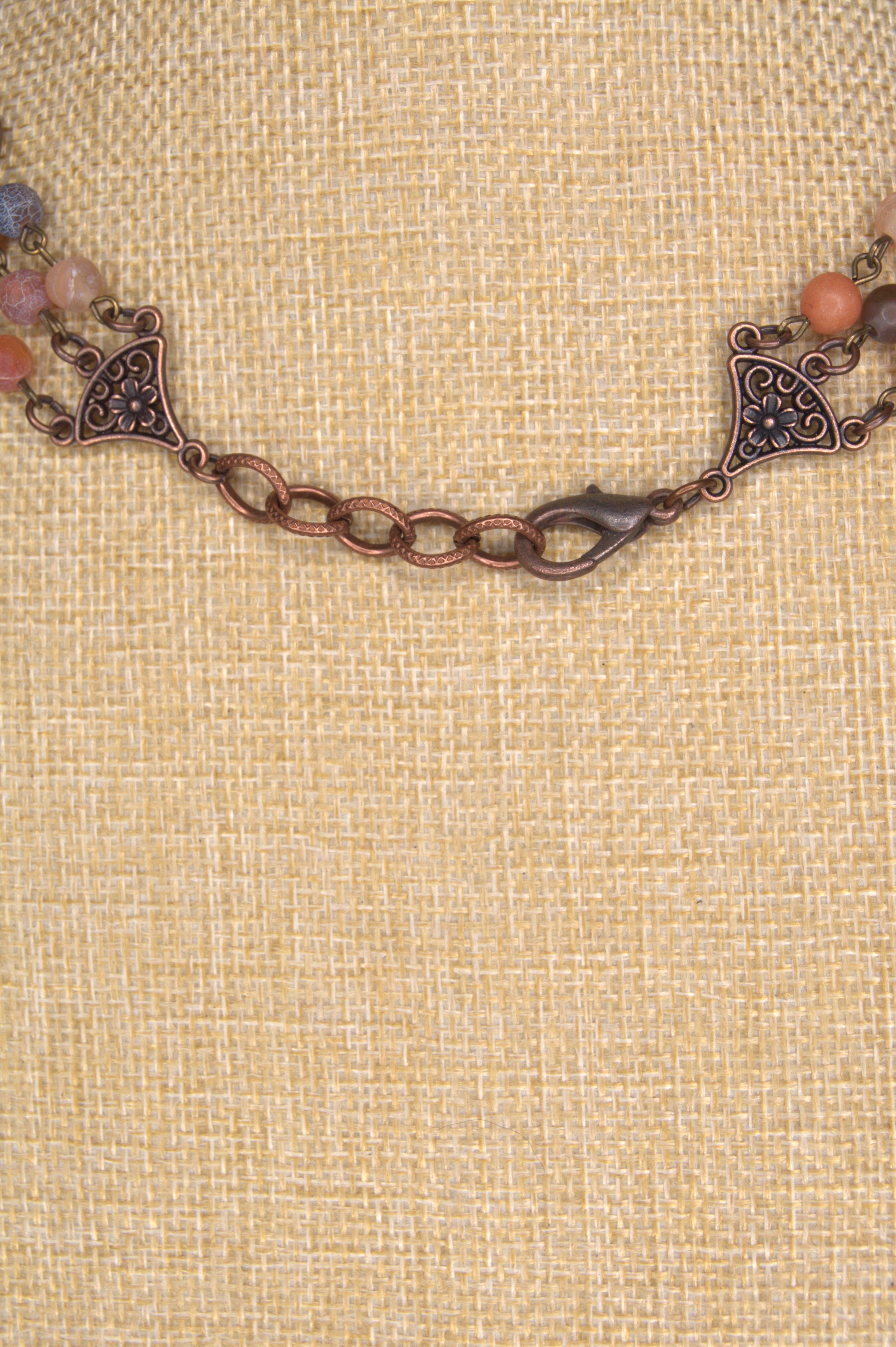Back of necklace showing a adjustable chain and Lobster clasp closure in copper