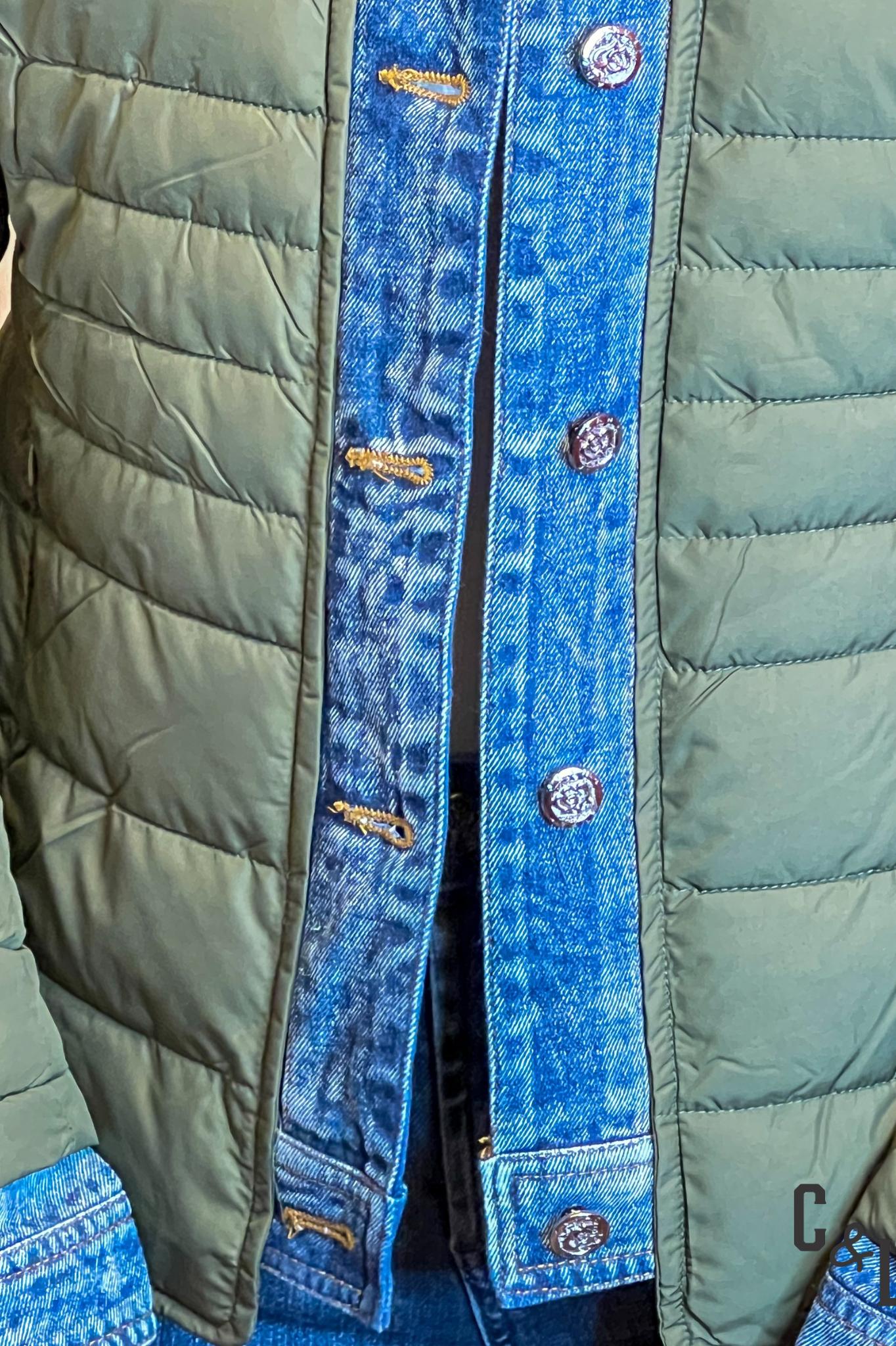 Green puffer jacket with blue denim trim
