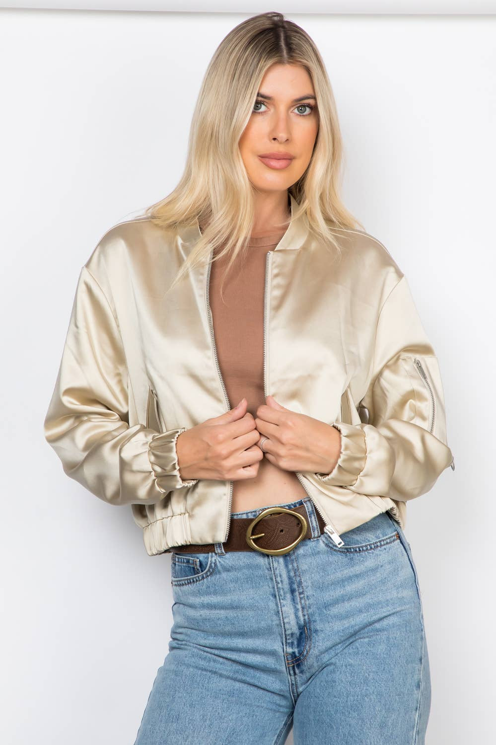 Lightweight satin bomber jacket featuring a relaxed fit, full front zipper, elastic cuffs, fully lined construction, utility sleeve pocket, and side pockets for polished everyday layering.