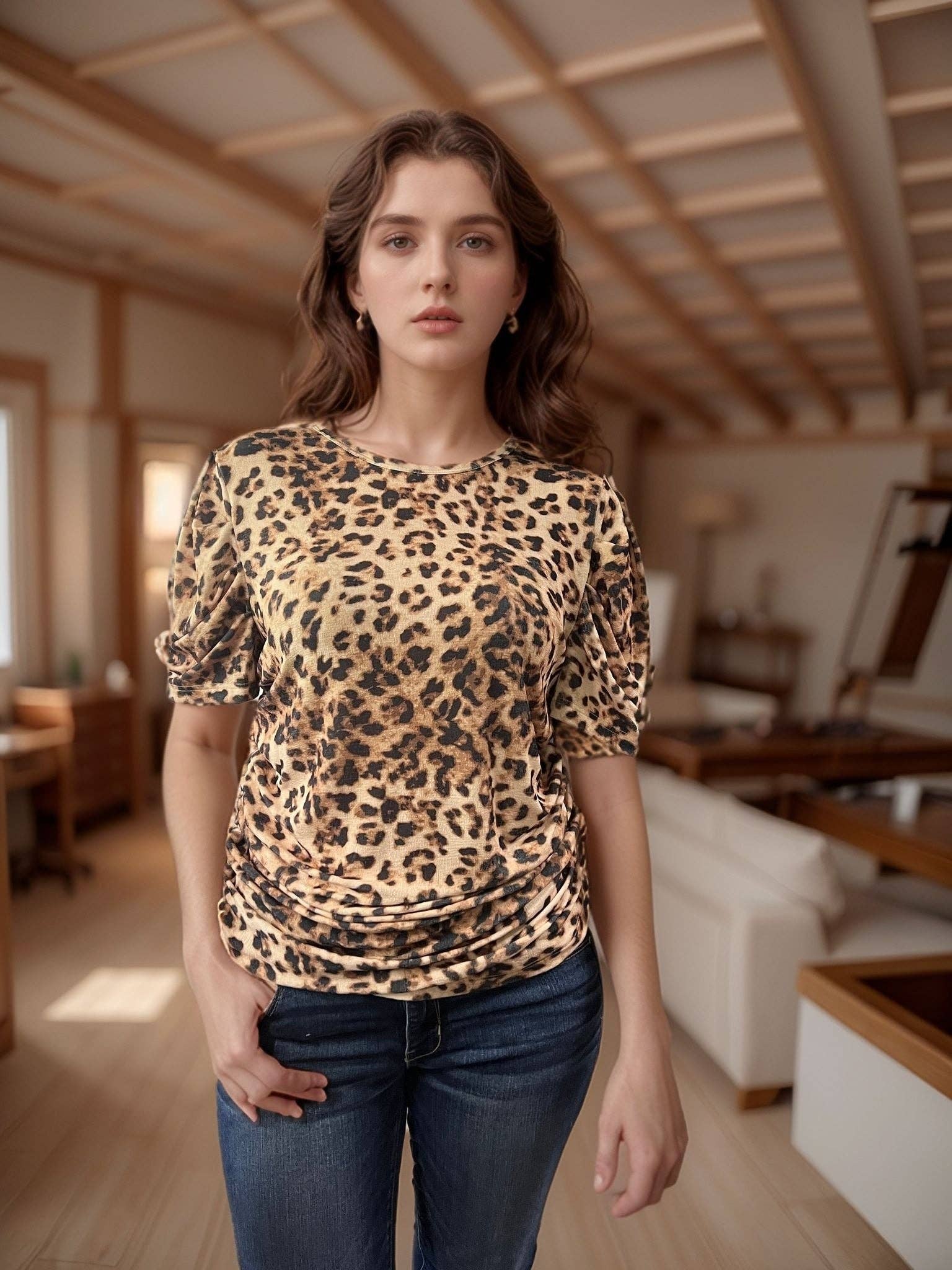 Woman wearing a leopard print top and blue jeans in a room with wooden beams.